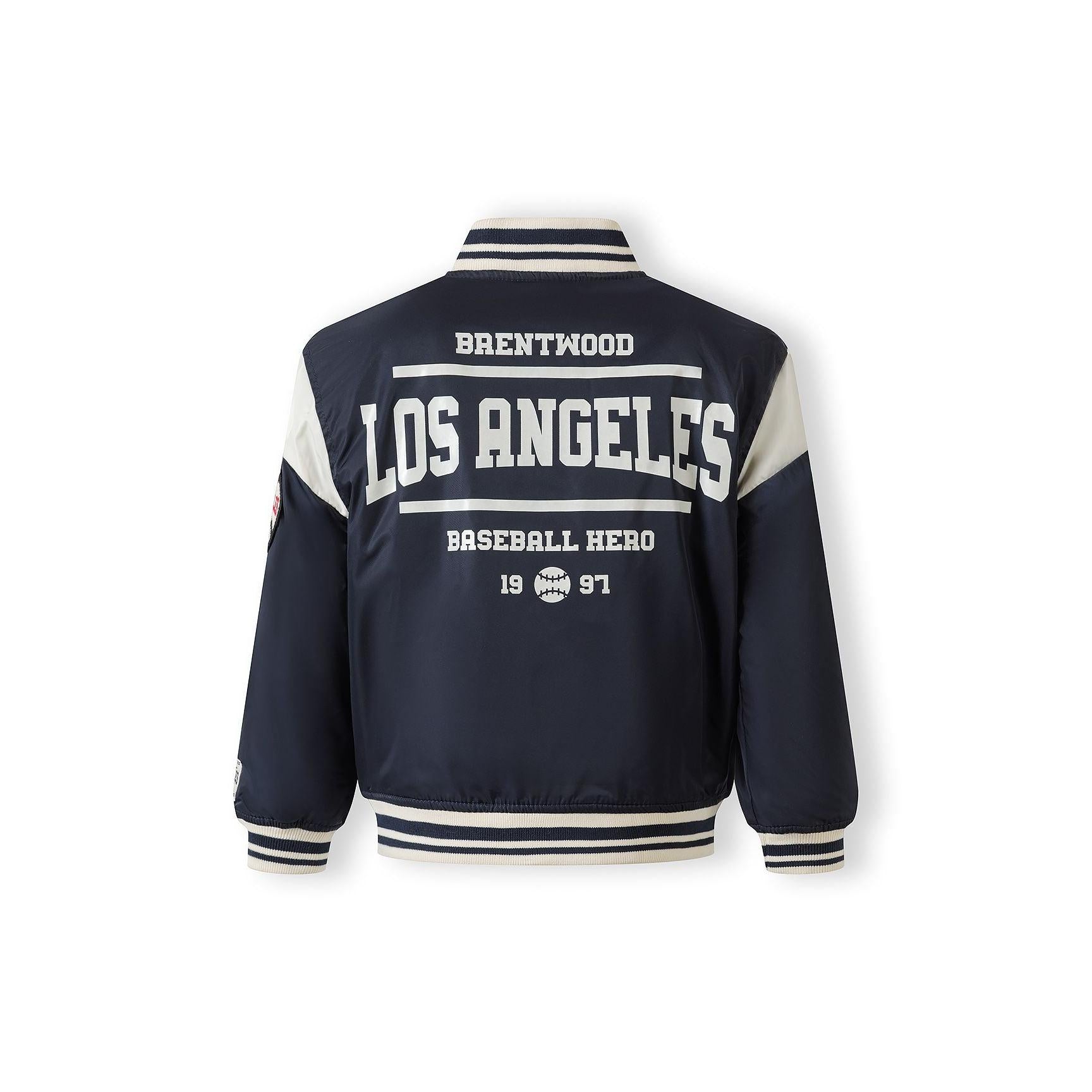 Close-up detail of navy bomber jacket showing inner pocket and quilted lining construction