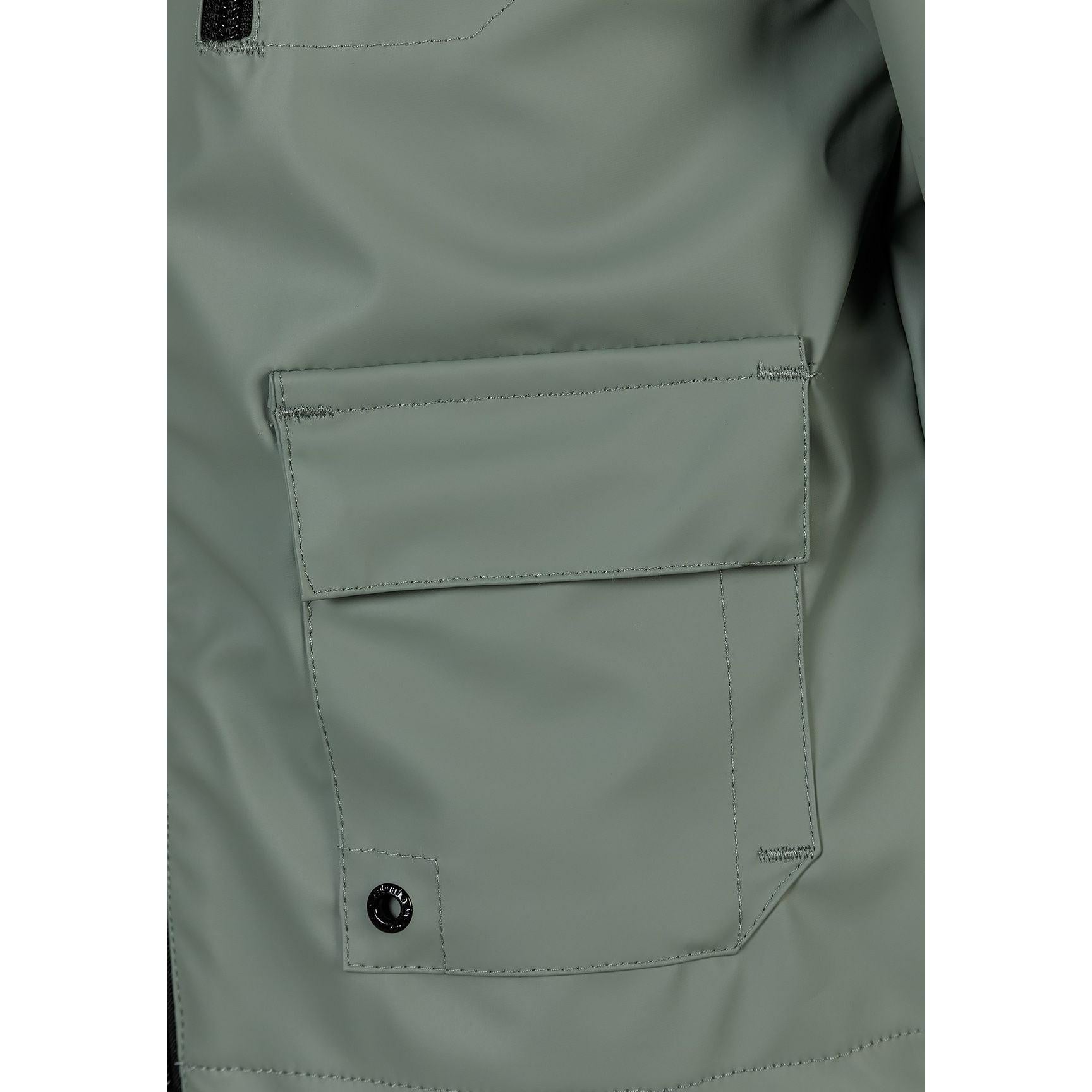 Close-up detail of sage green parka jacket pocket with flap closure and snap button, showing fabric texture and stitching