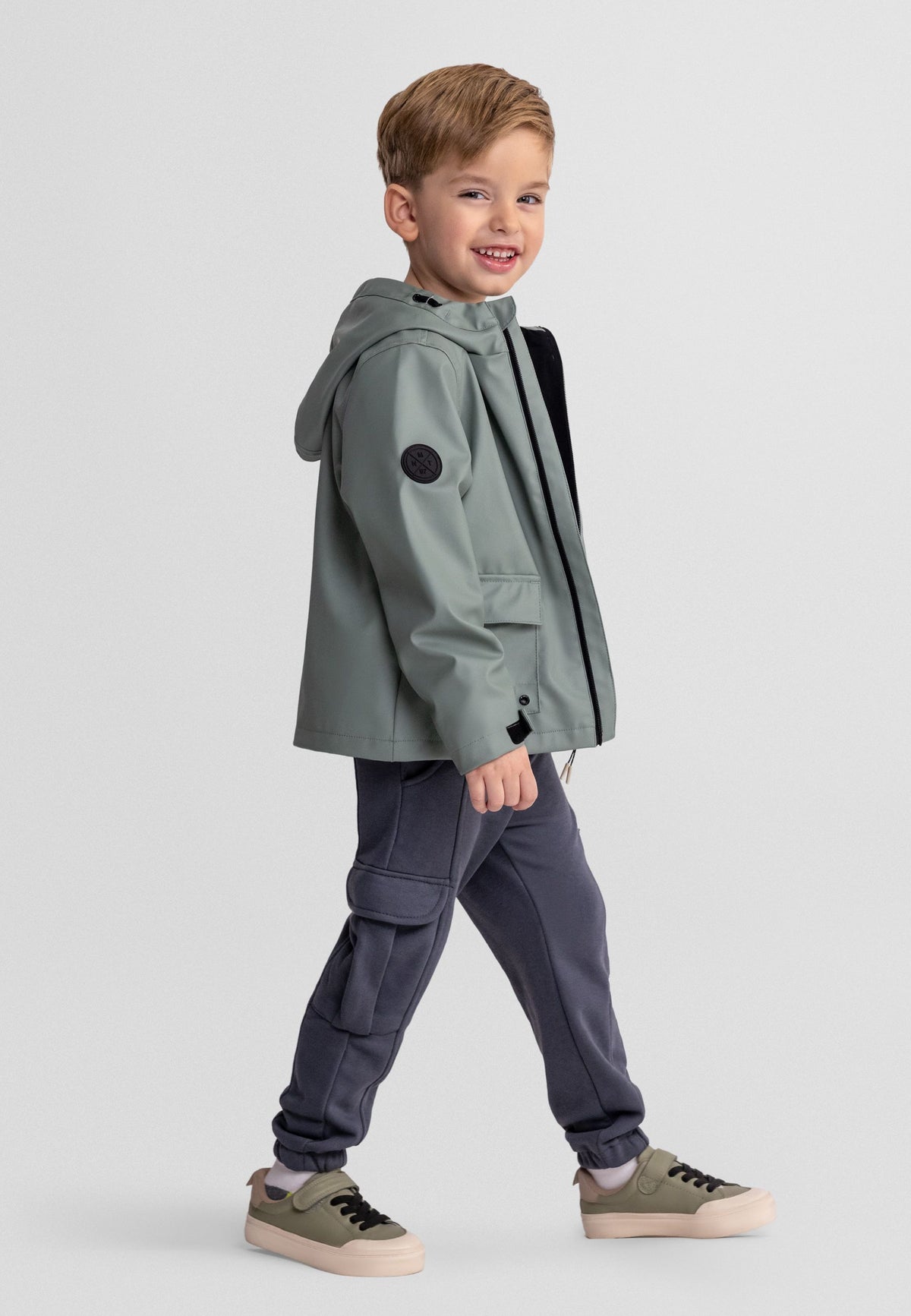 Boys' sage green hooded jacket, shown worn.