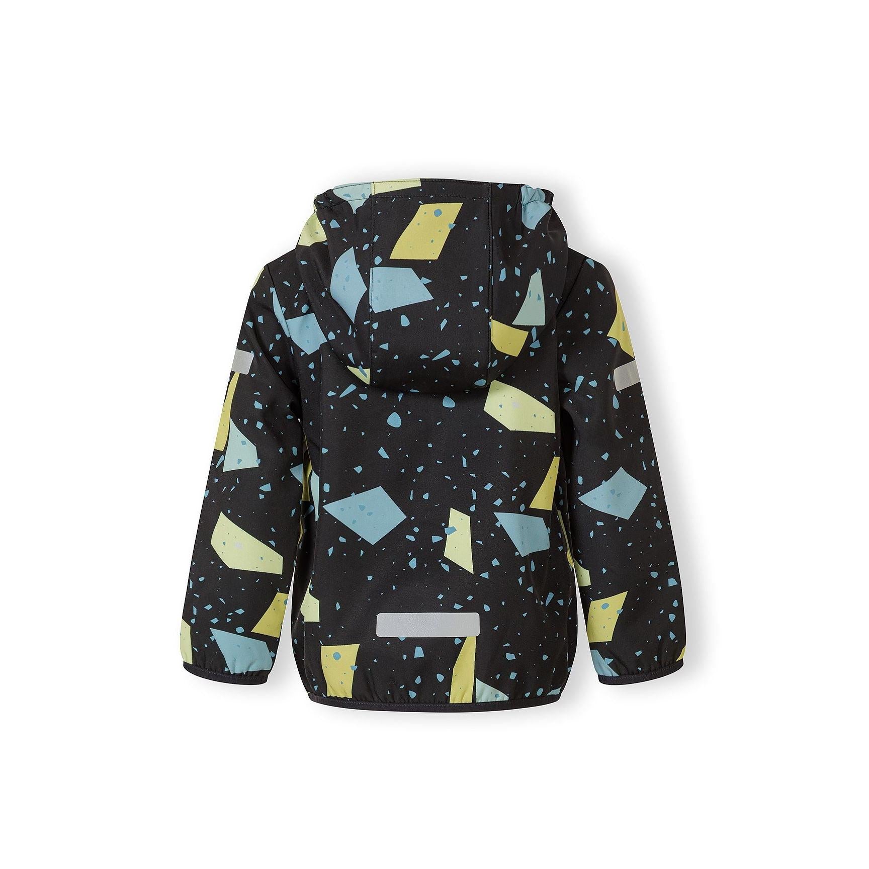 Close-up detail of abstract geometric print on gunmetal fabric showing yellow and blue geometric shapes with scattered dots and triangular elements