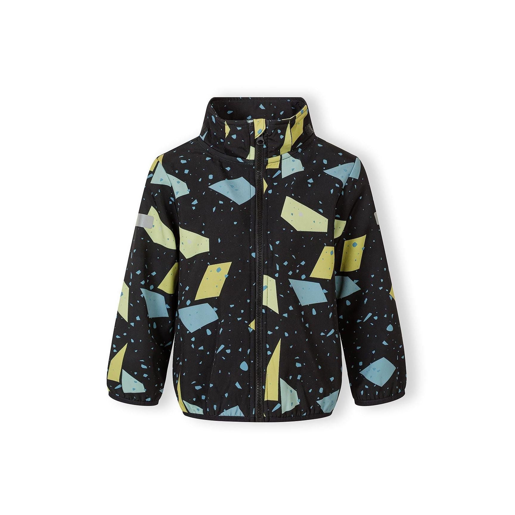 Close-up detail of abstract geometric print on gunmetal fabric showing yellow and blue geometric shapes with scattered dots and triangular elements