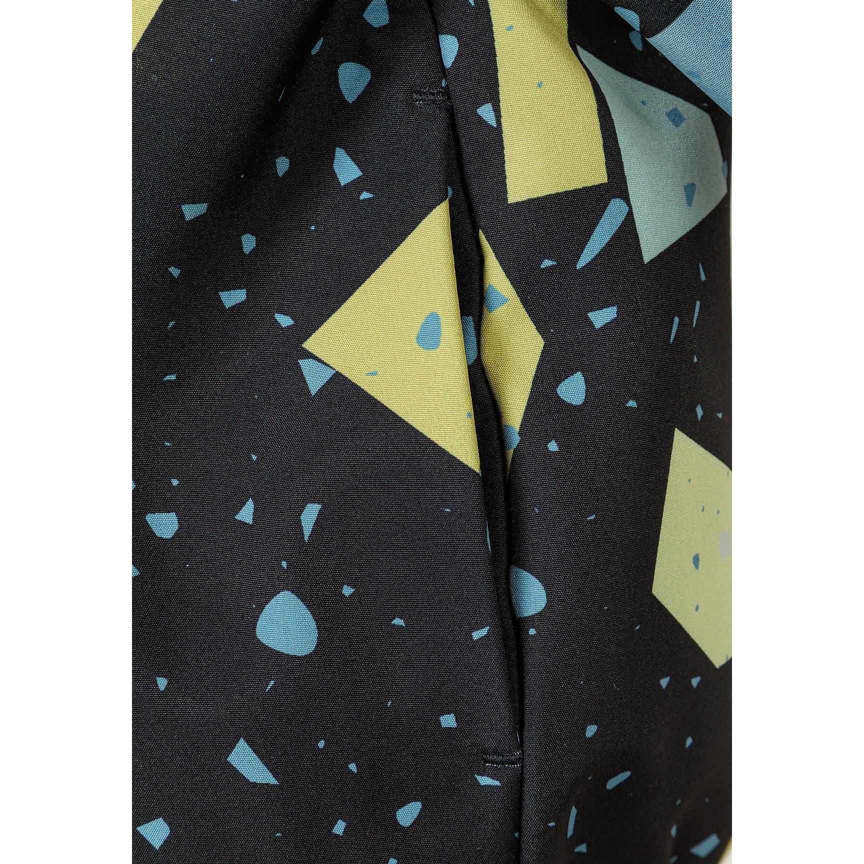 Close-up detail of abstract geometric print on gunmetal fabric showing yellow and blue geometric shapes with scattered dots and triangular elements