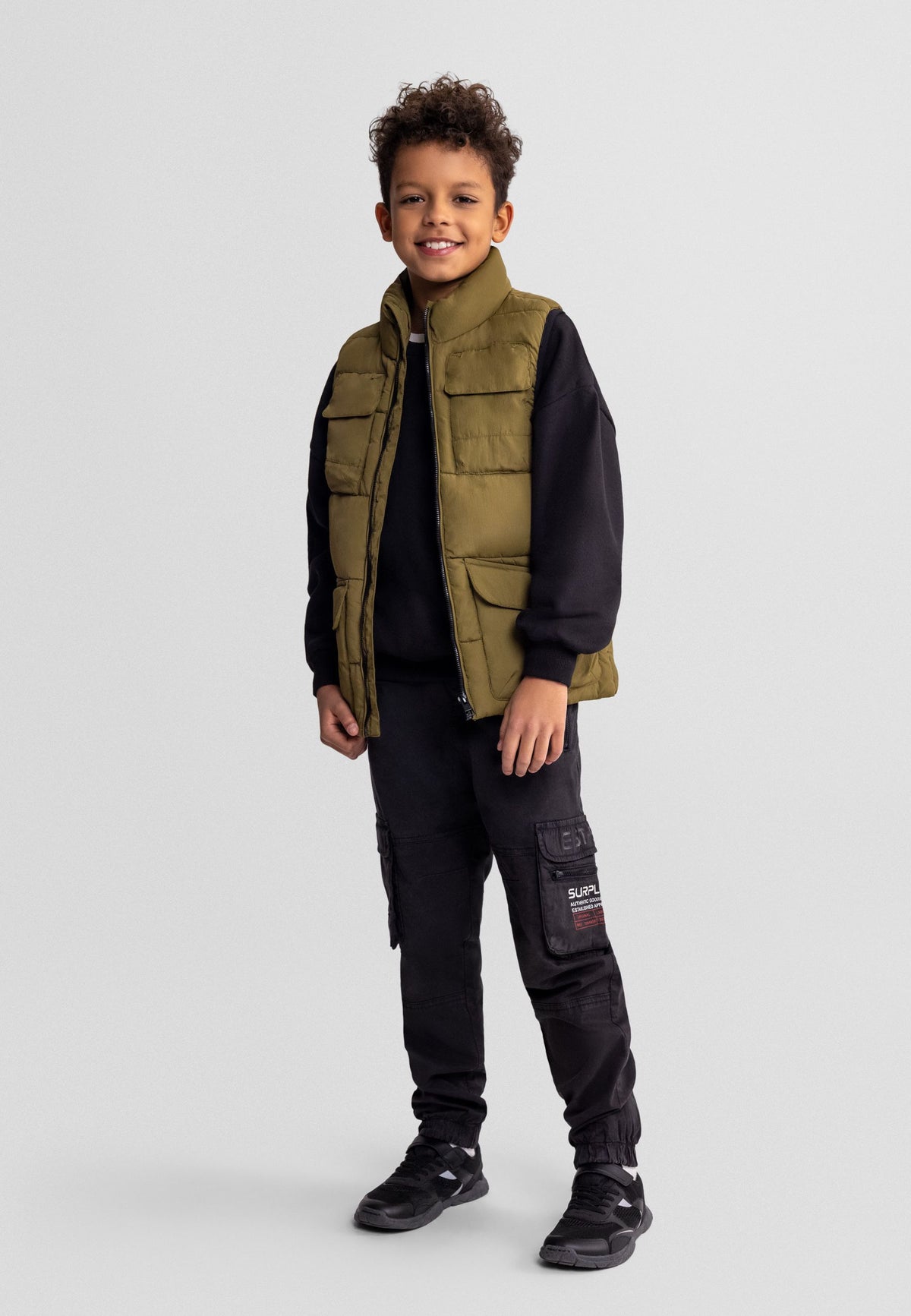 Olive green utility padded gilet, model front.