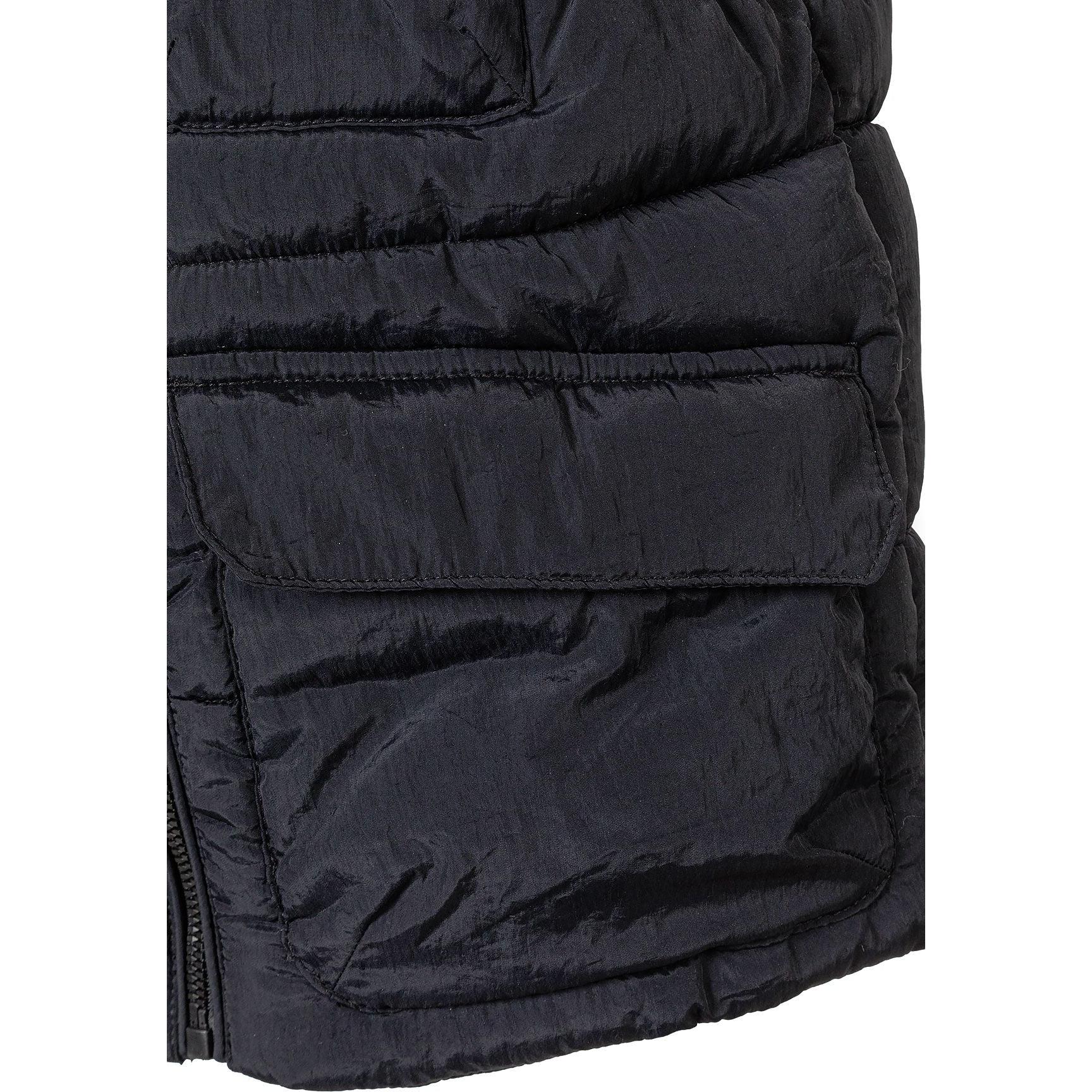 Close-up detail of black quilted waistcoat showing front zipper, quilted texture and flap pocket construction