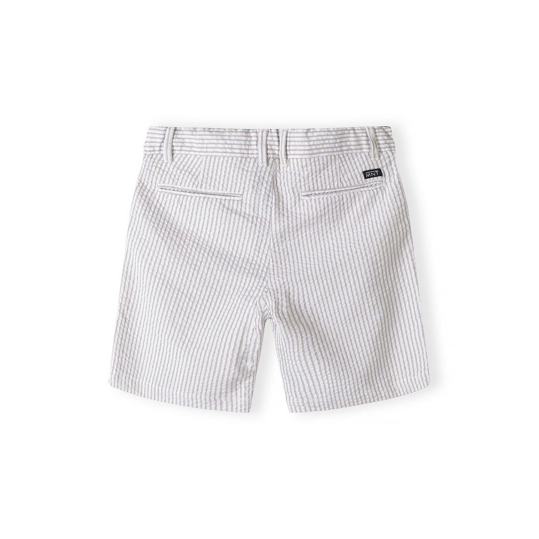 Back view of stone stripe tailored cotton suit shorts showing structured design and rear pockets with brand label