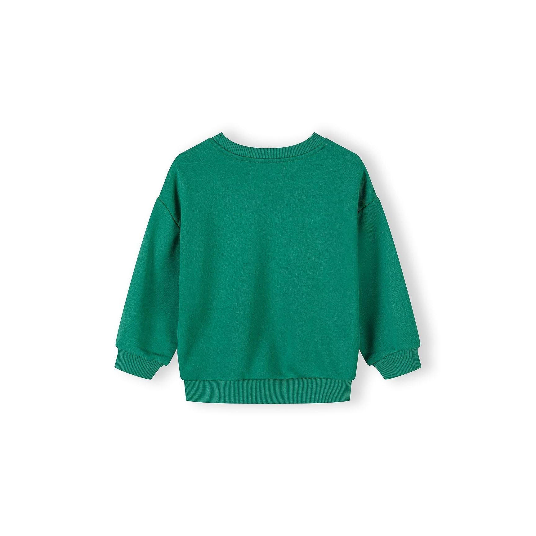 Detail view of cream sweatshirt featuring Fun Days text with Always script overlay and Minoti brand label visible at neckline