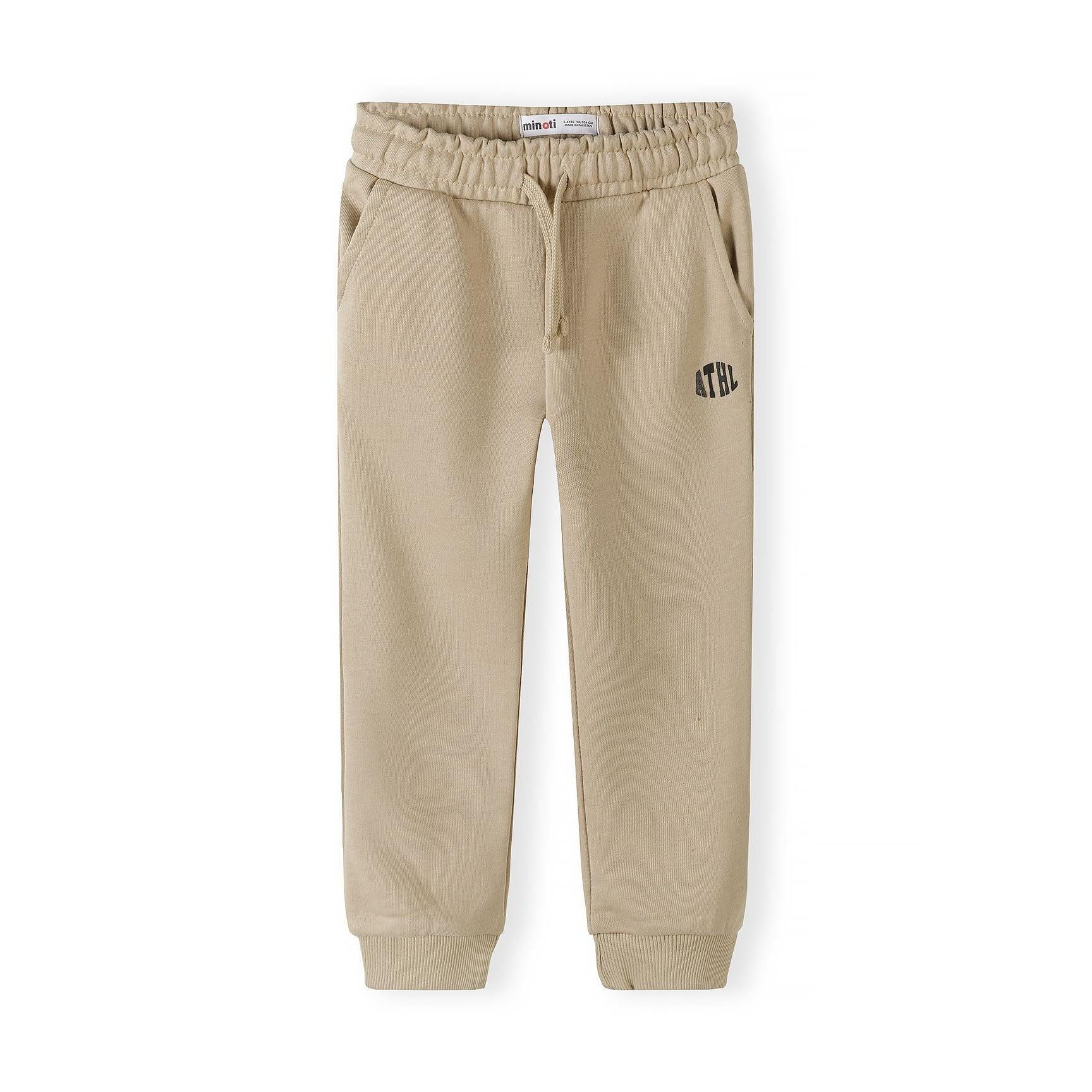 Single black Minoti joggers with Minoti label visible, showing drawstring waist and ATHL logo placement on white background