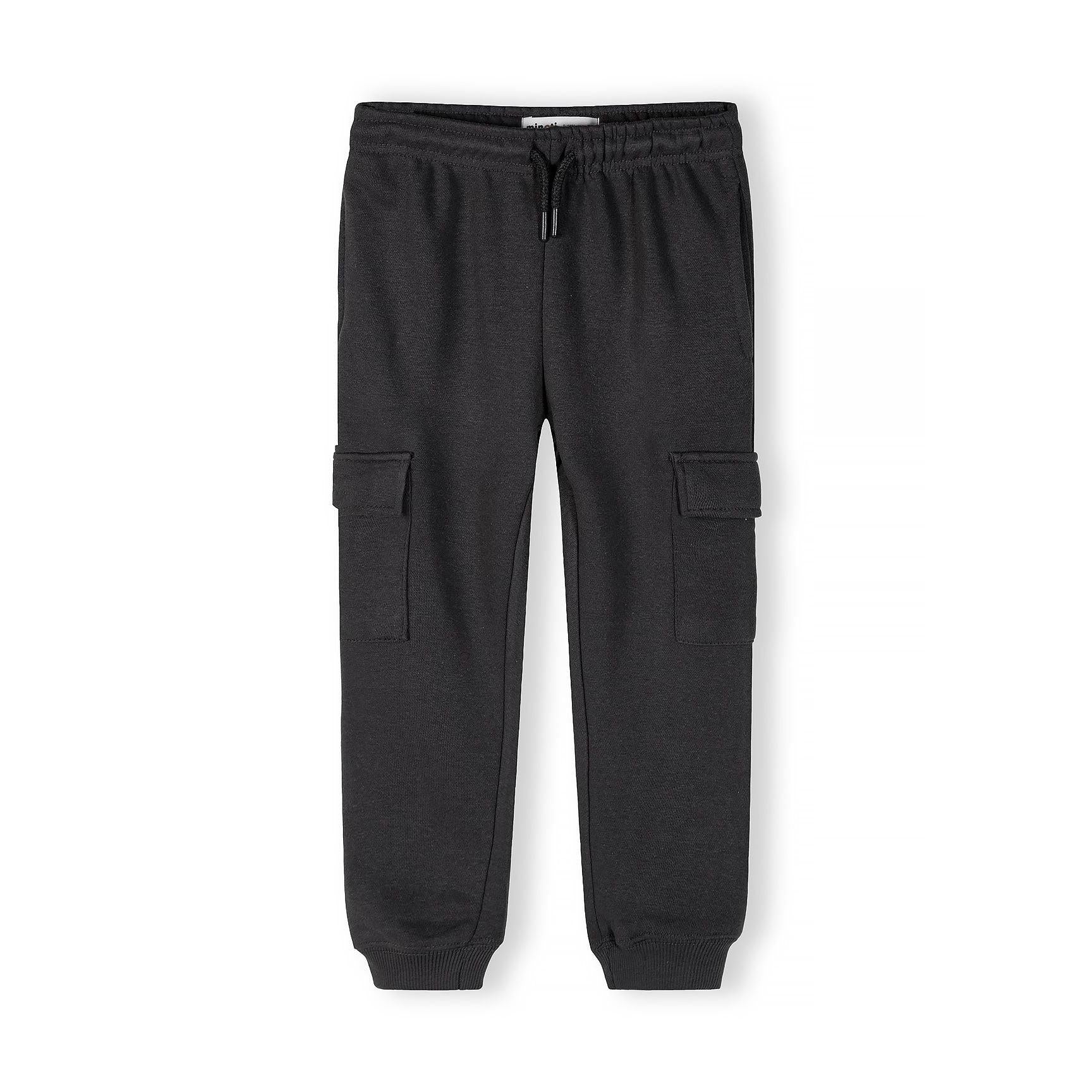 Close-up detail of light grey cargo joggers showing ribbed waistband texture and fabric quality on white background