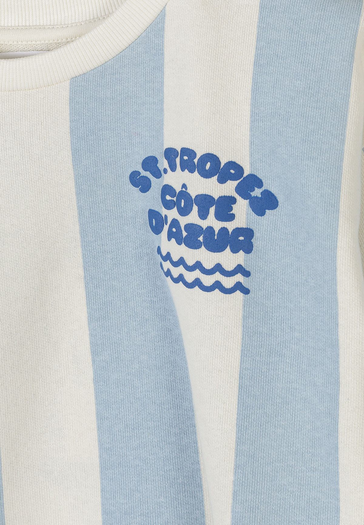 Detail of a boys' blue and white striped sweatshirt with a logo print.