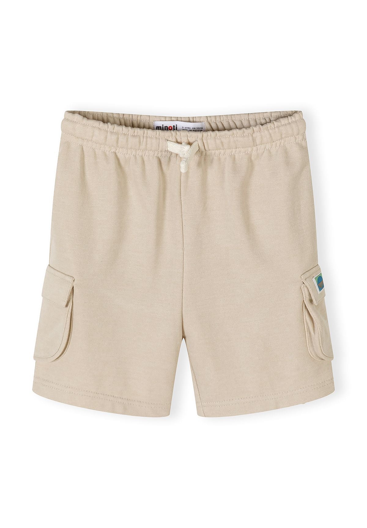 Detail of beige combat shorts with elasticated waistband and cargo pockets.
