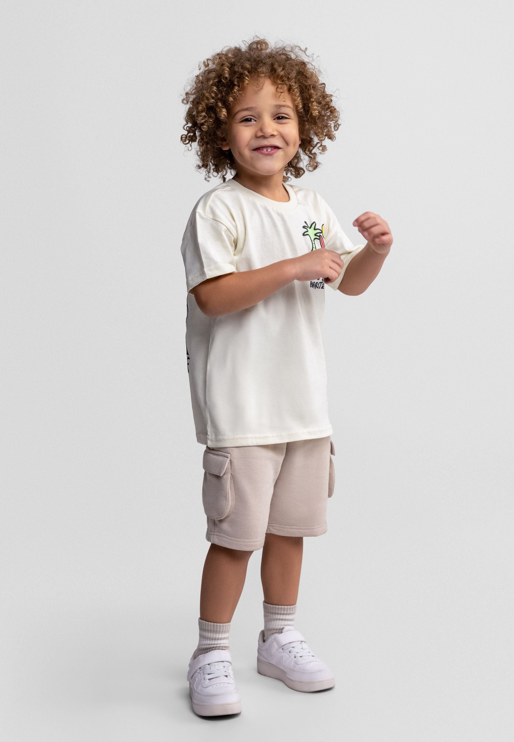Boys' two-piece outfit with short sleeve t-shirt and combat shorts, front view, featuring cargo pockets.