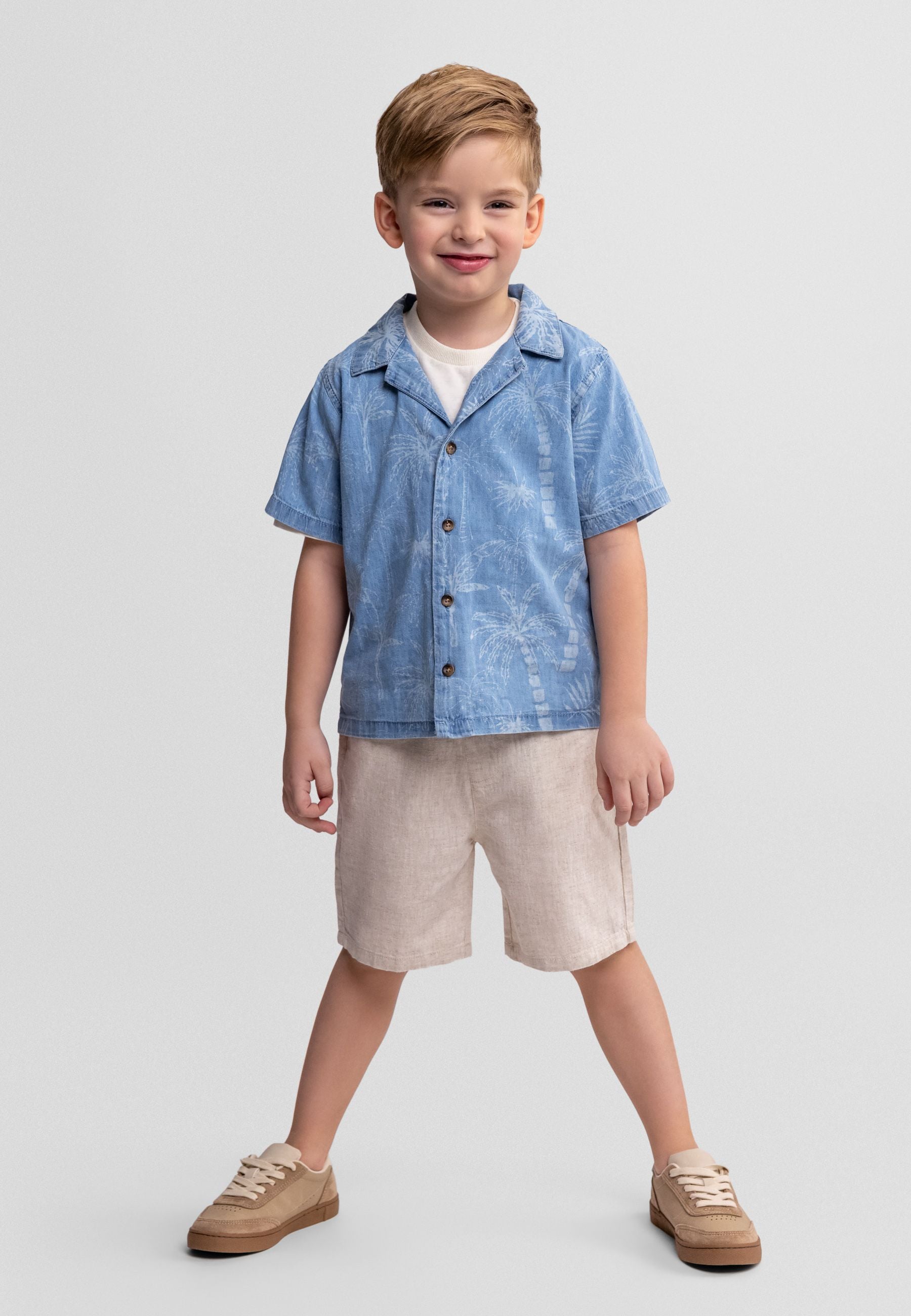 Boys medium blue short sleeve shirt with button-down front and chest pocket.