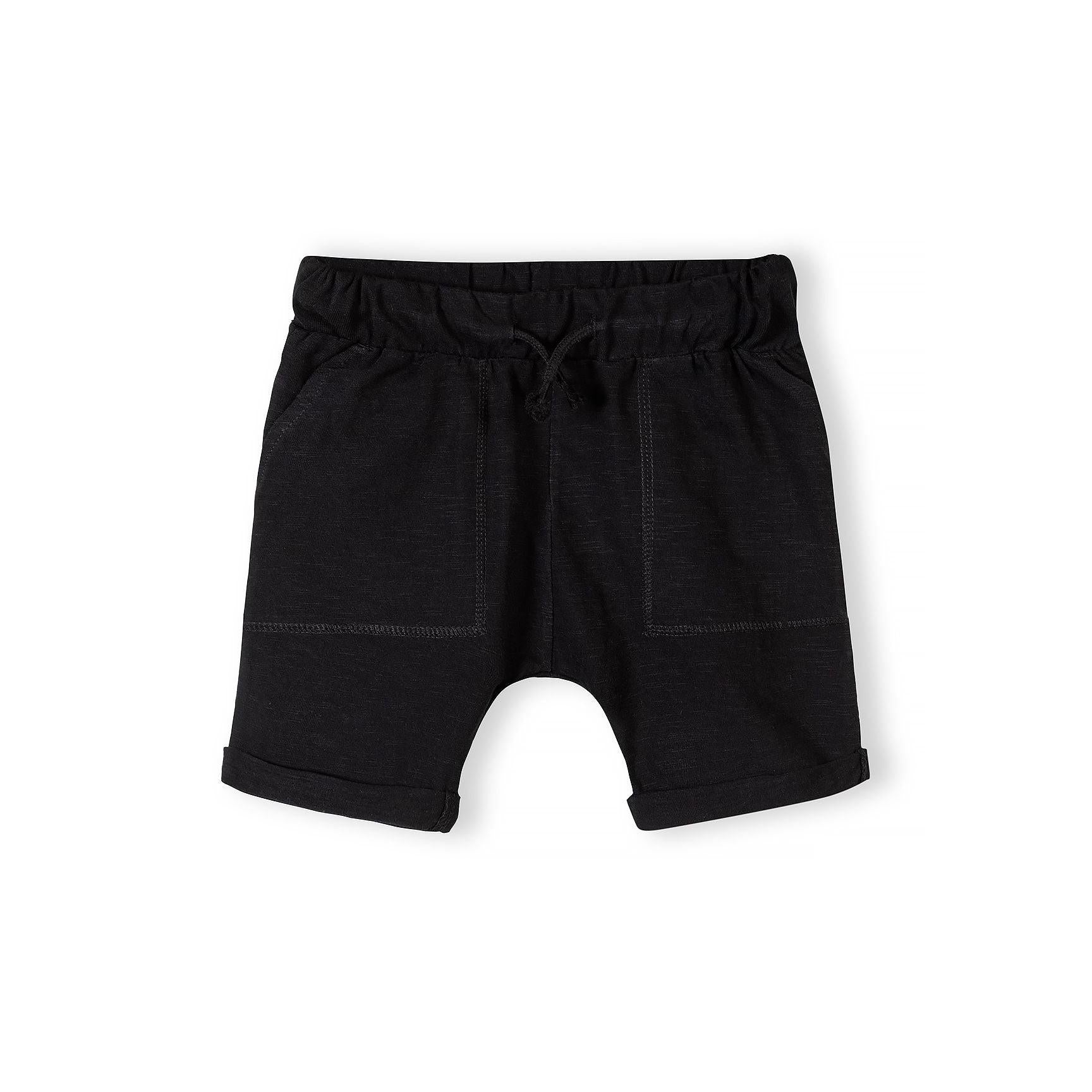 Single black cotton slub jersey shorts with elasticated waistband, drawstring and side pockets with rolled hem on white background