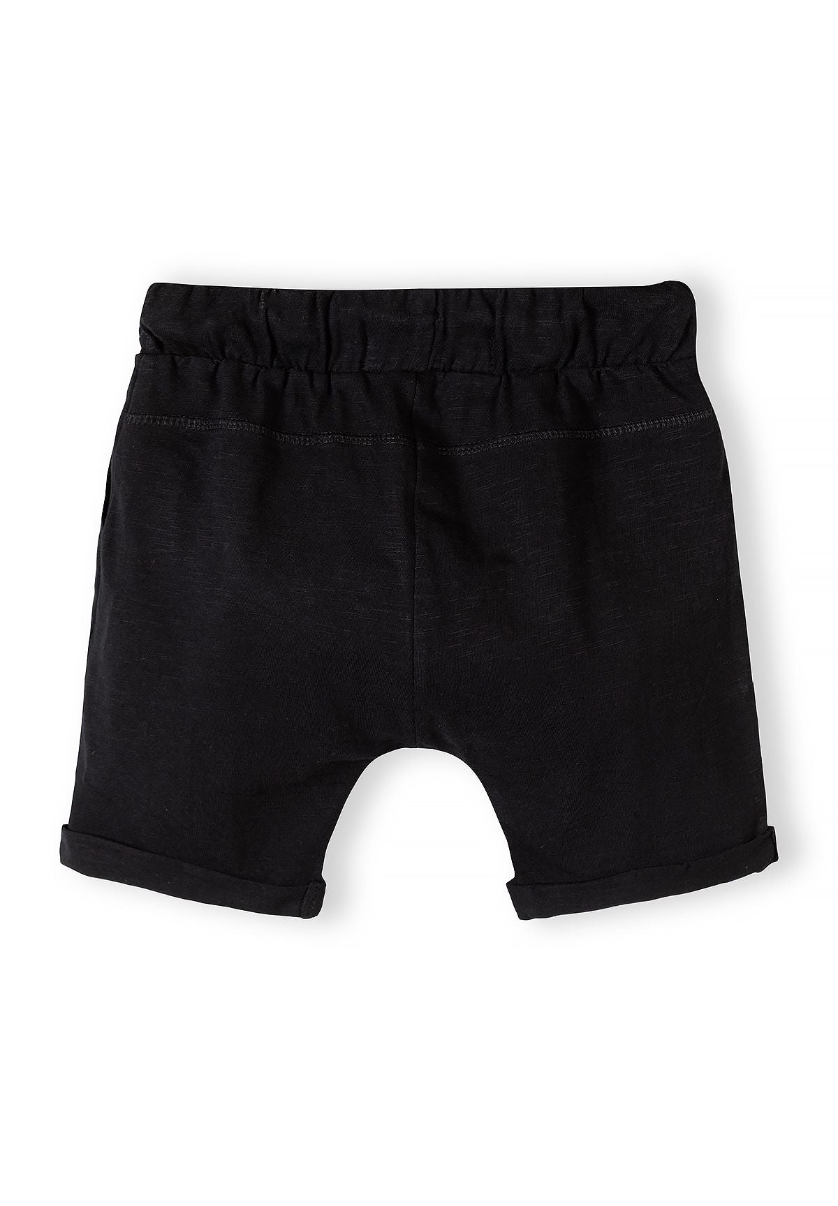 Back view of black boys' shorts with elasticated waistband and rolled cuffs.