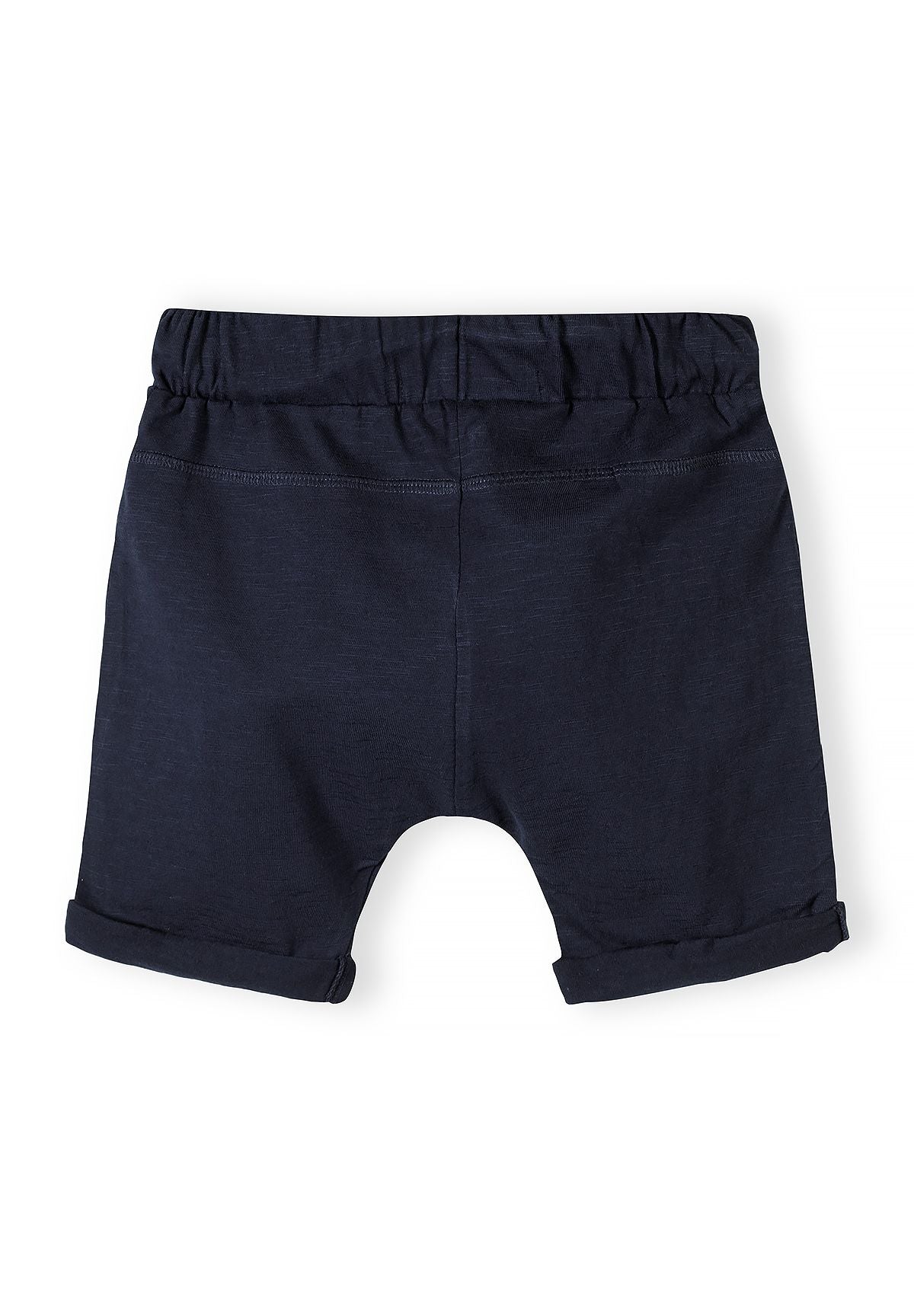 Boys cotton jersey shorts, back view, navy with rolled hems and elastic waistband.