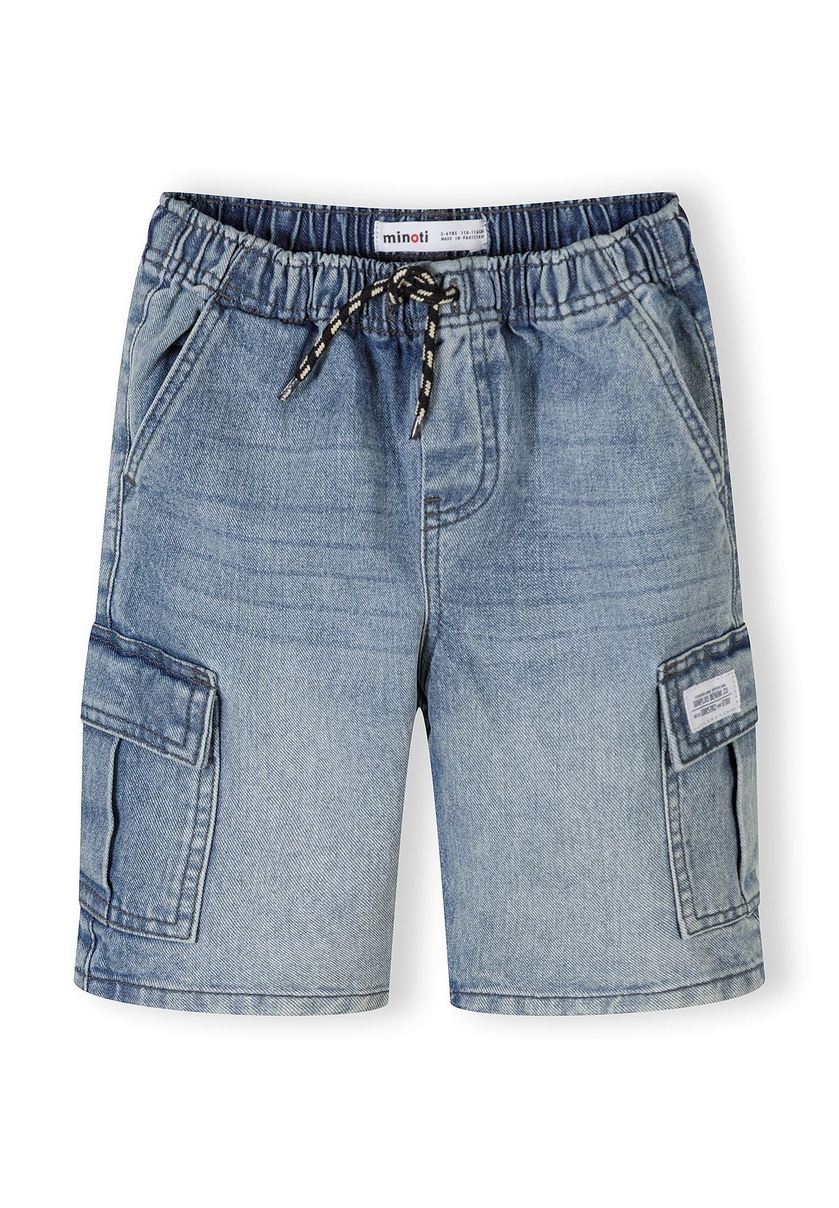 Close-up detail of light blue denim cargo shorts showing Minoti label, elastic waistband with rope drawstring and cargo pocket construction