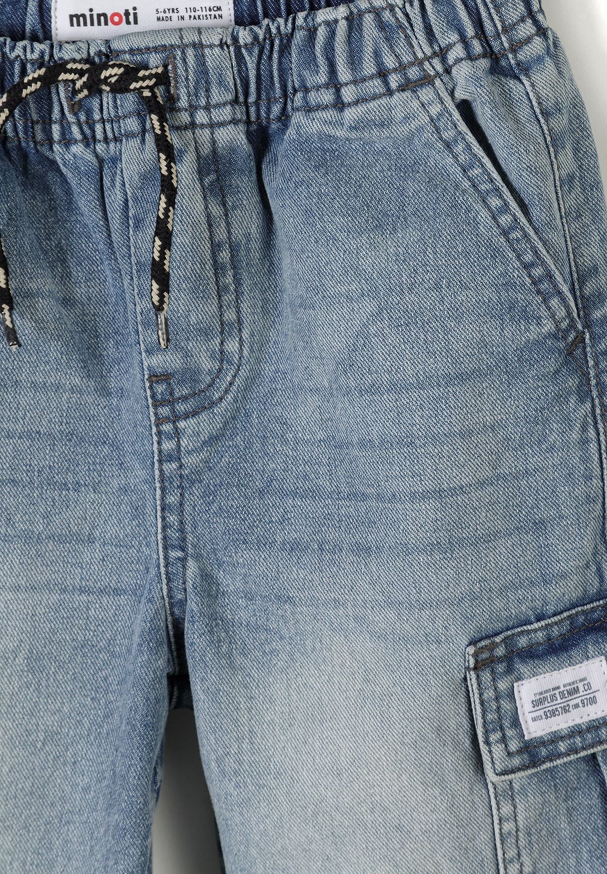 Detail of boys' denim combat shorts with elasticated waistband and cargo pocket.