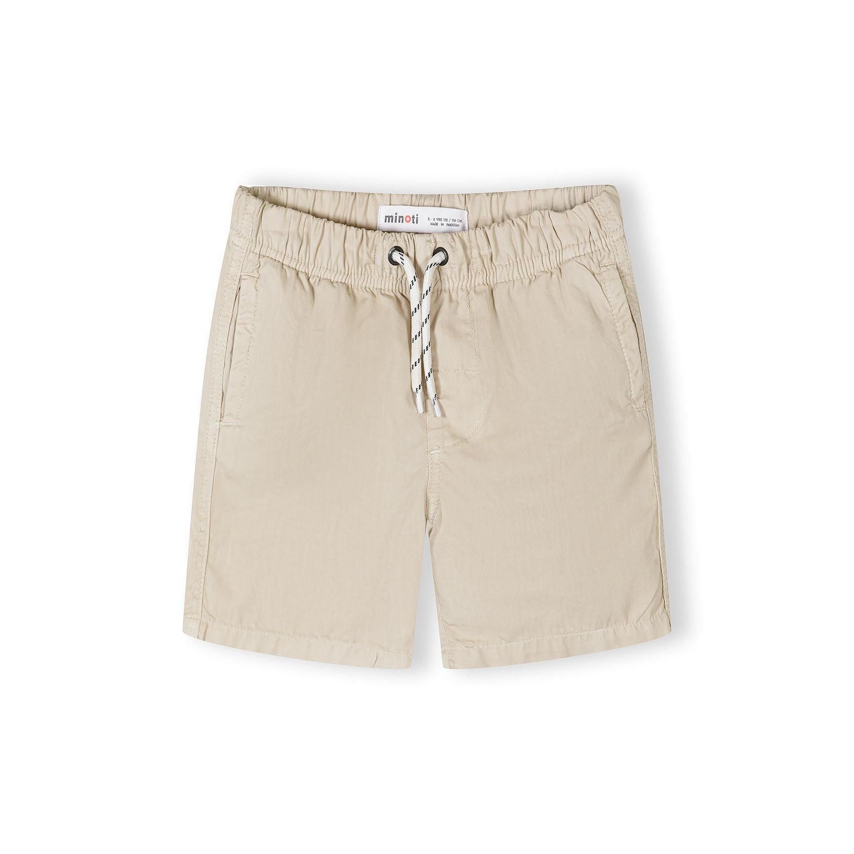 Single beige cotton shorts displayed flat showing elasticated waistband with rope drawstring and side pockets on white background