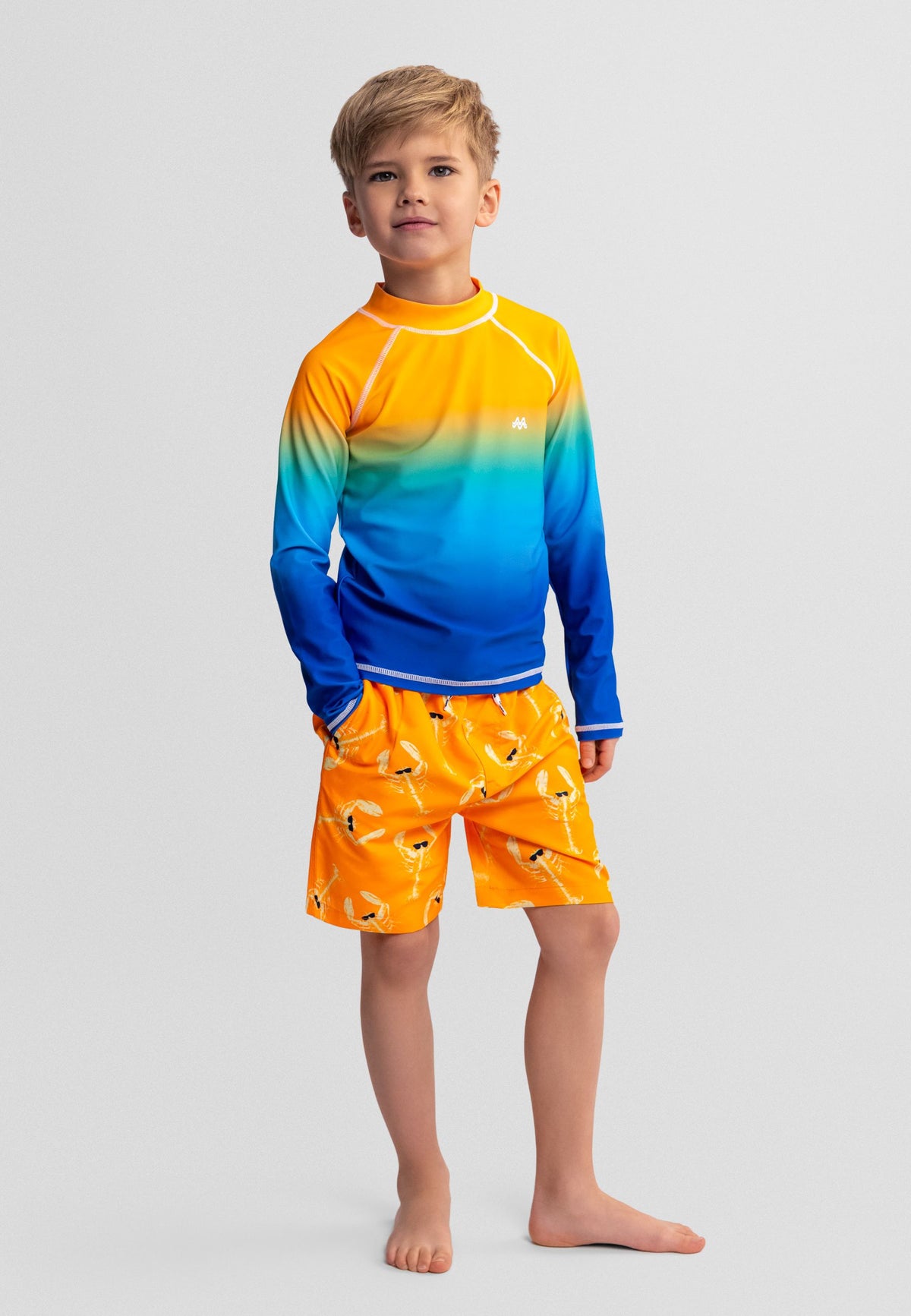 Orange and blue swim shorts, model wearing lobster print.