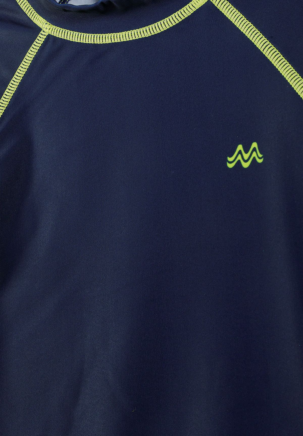 Close-up of a navy rash top with lime stitching and logo.
