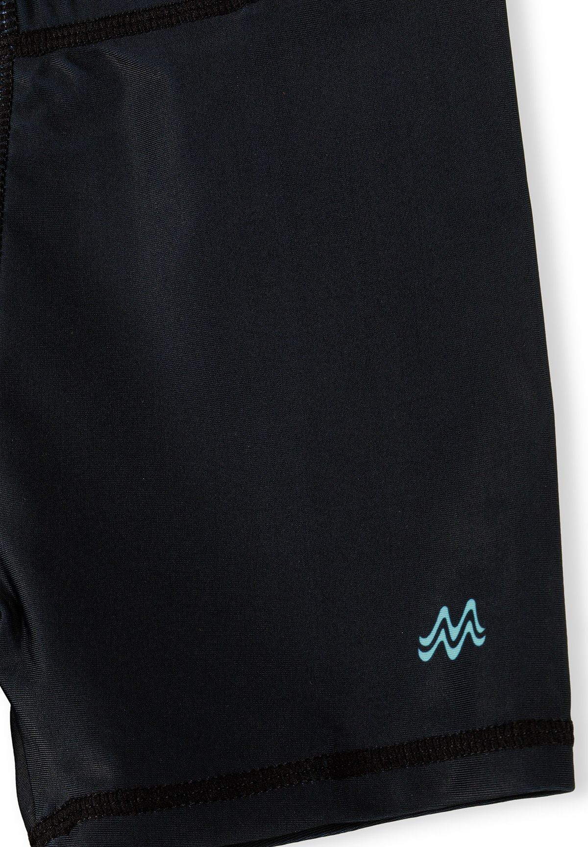 Detail of black swim shorts with elastic waistband and logo.