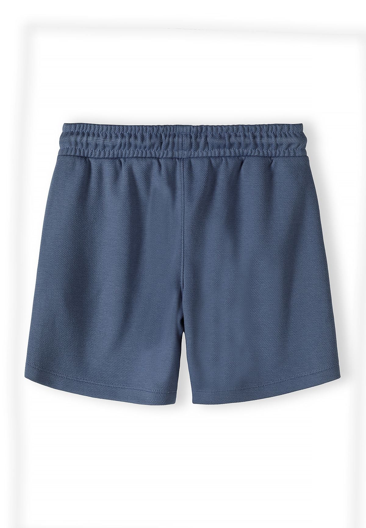 Detail of navy blue shorts with an elastic waistband.