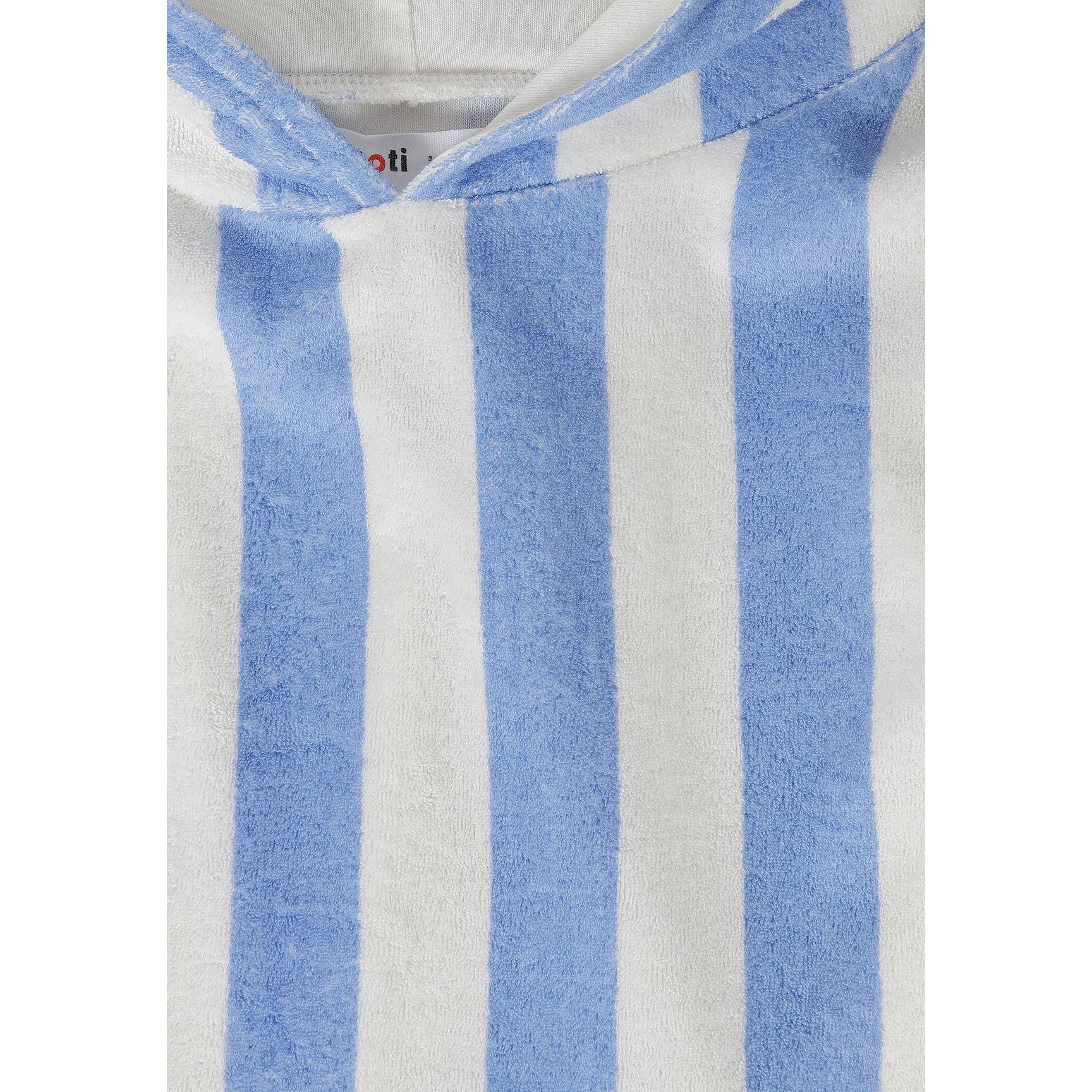 Close-up detail of blue and white striped towelling fabric texture with Minoti brand label visible at neckline