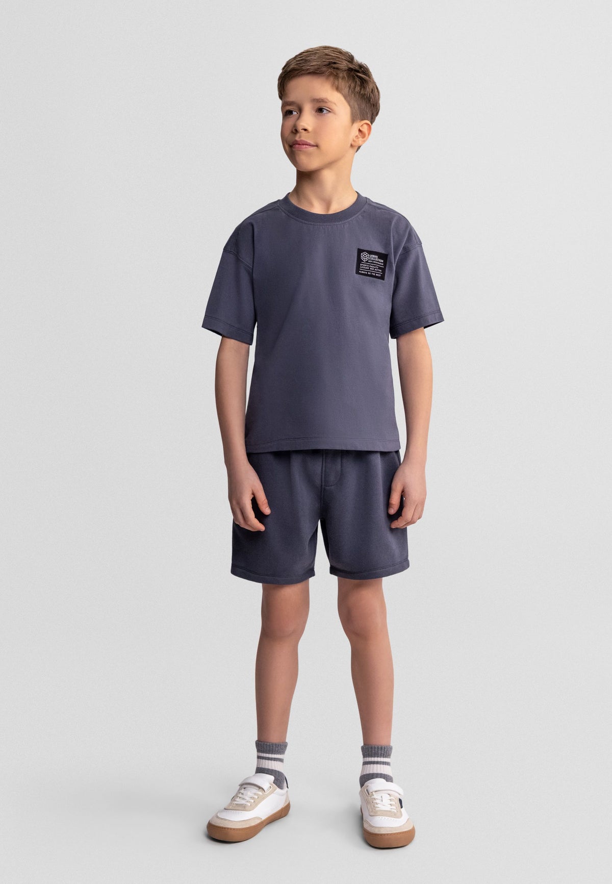 Charcoal t-shirt and shorts set, model front.