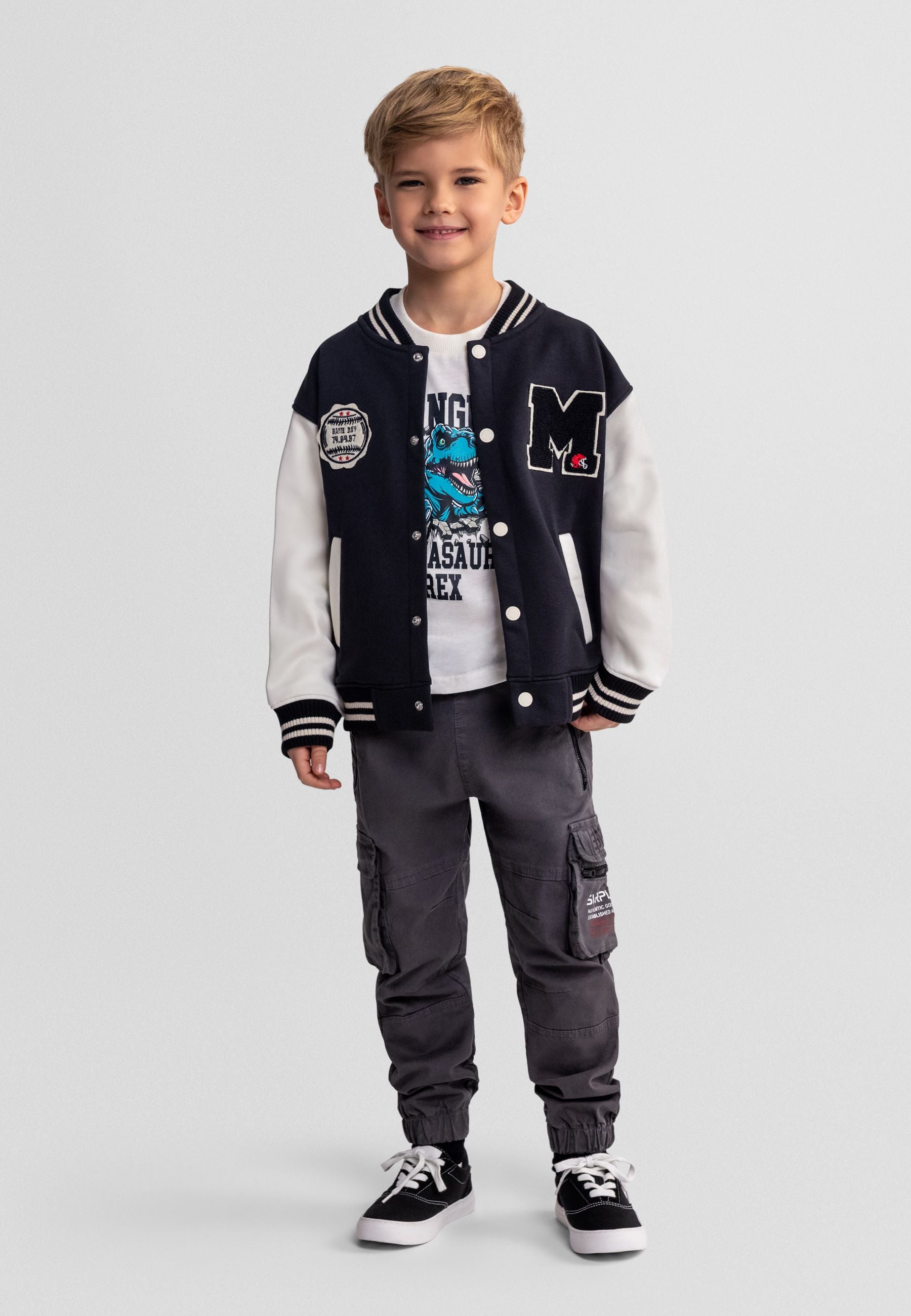 Boys' lightweight baseball jacket with black and white sleeves, worn by a child.