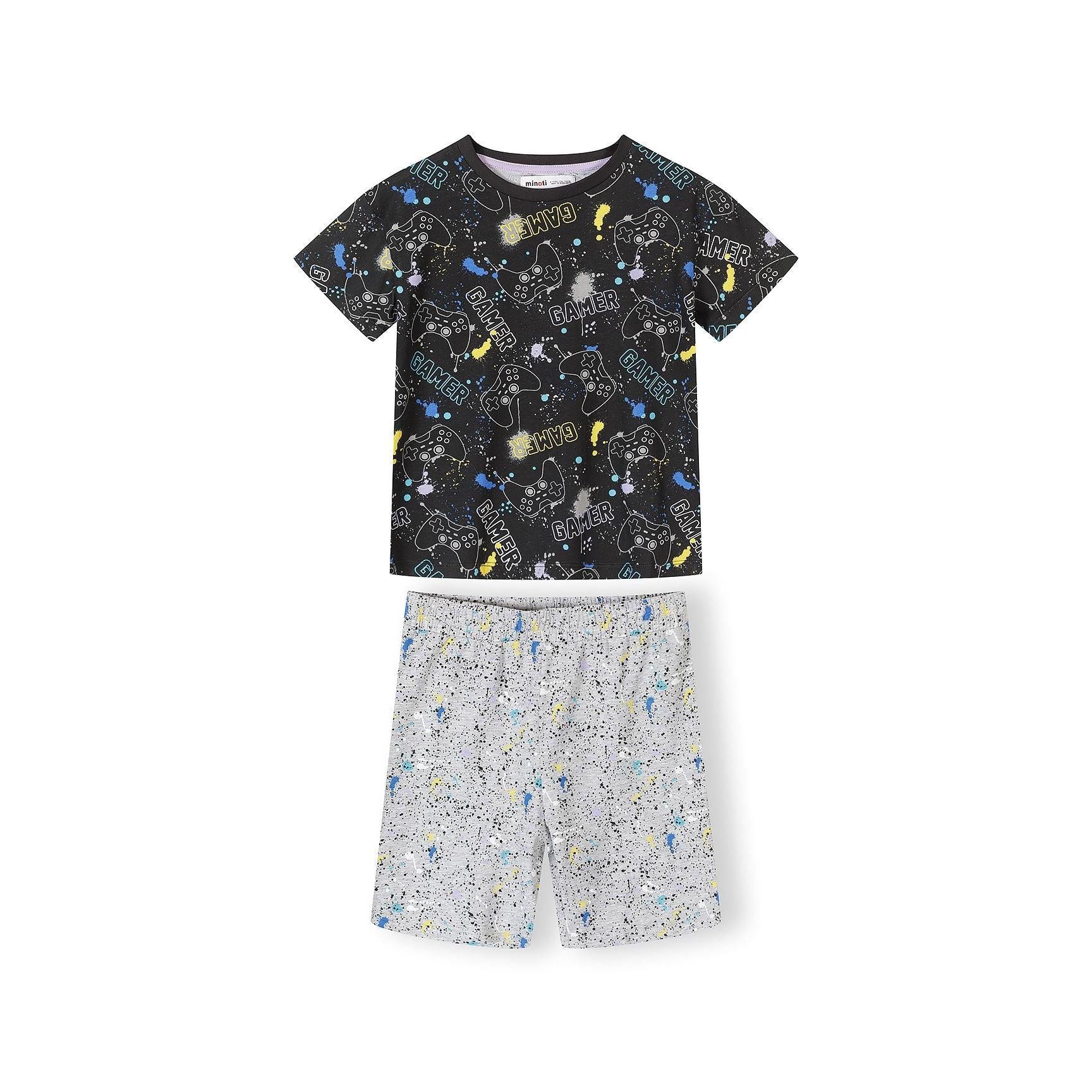 Close-up view of gaming pajama set showing black printed t-shirt with gamer graphics and grey shorts with colorful splatter pattern on white background