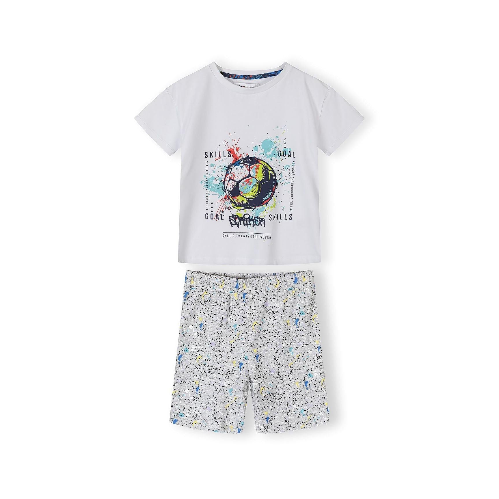 Blue football print t-shirt with navy shorts showing vibrant all-over soccer ball pattern with colorful graffiti-style design on white background