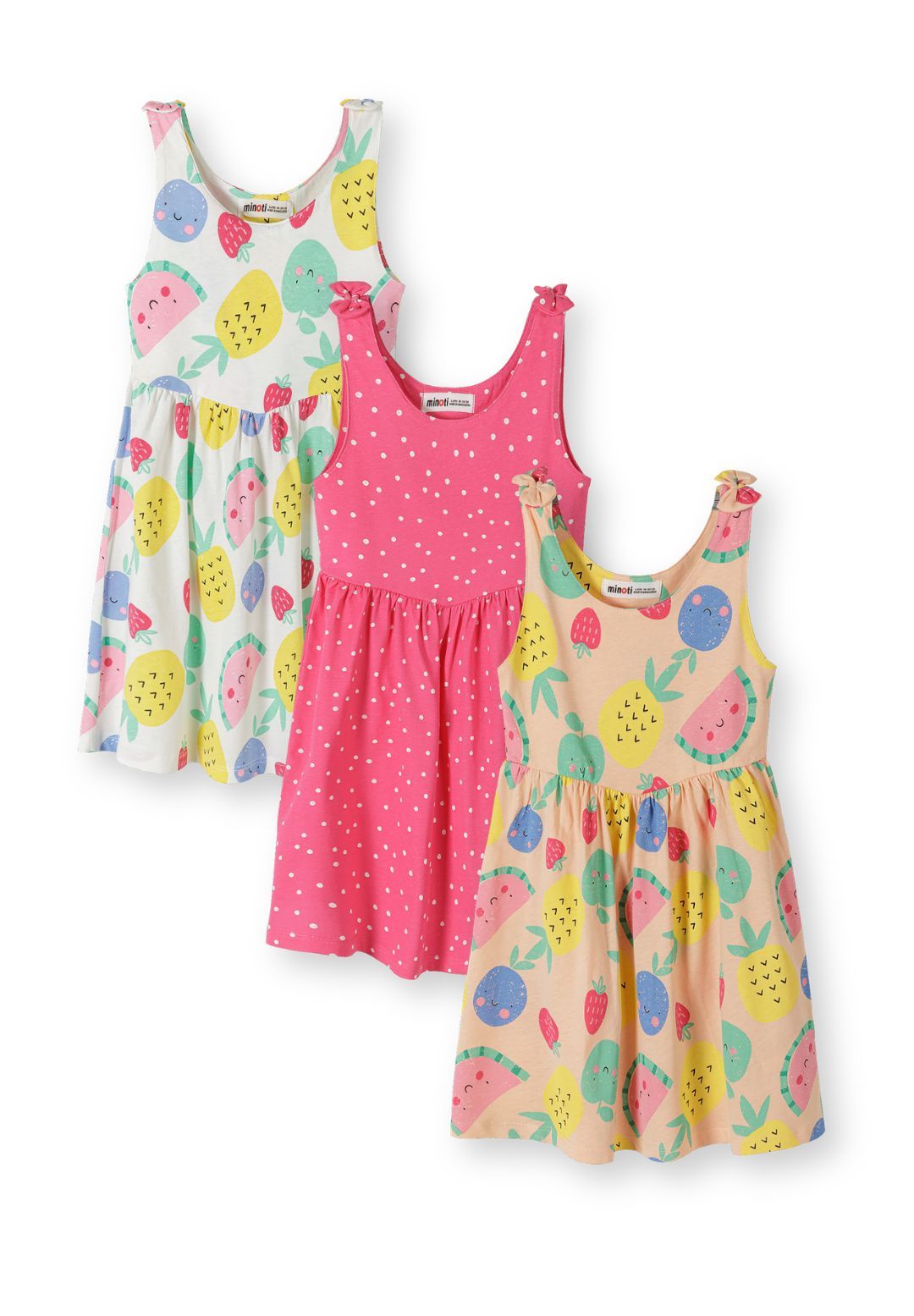 Three sleeveless dresses displayed on white background - white dress with colorful fruit print, pink dress with white polka dots, and apricot dress with fruit pattern