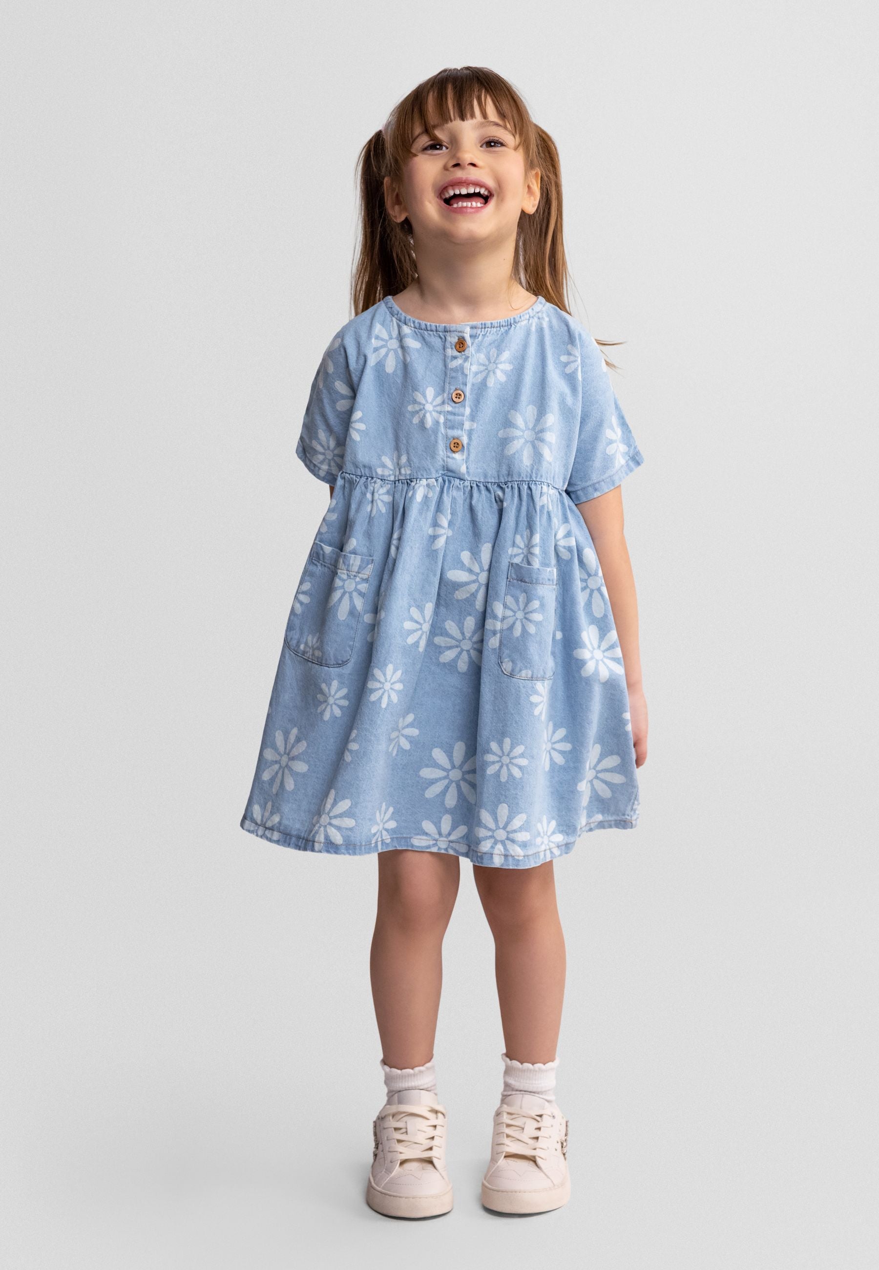 Girls chambray dress with floral print, short sleeves, front view.
