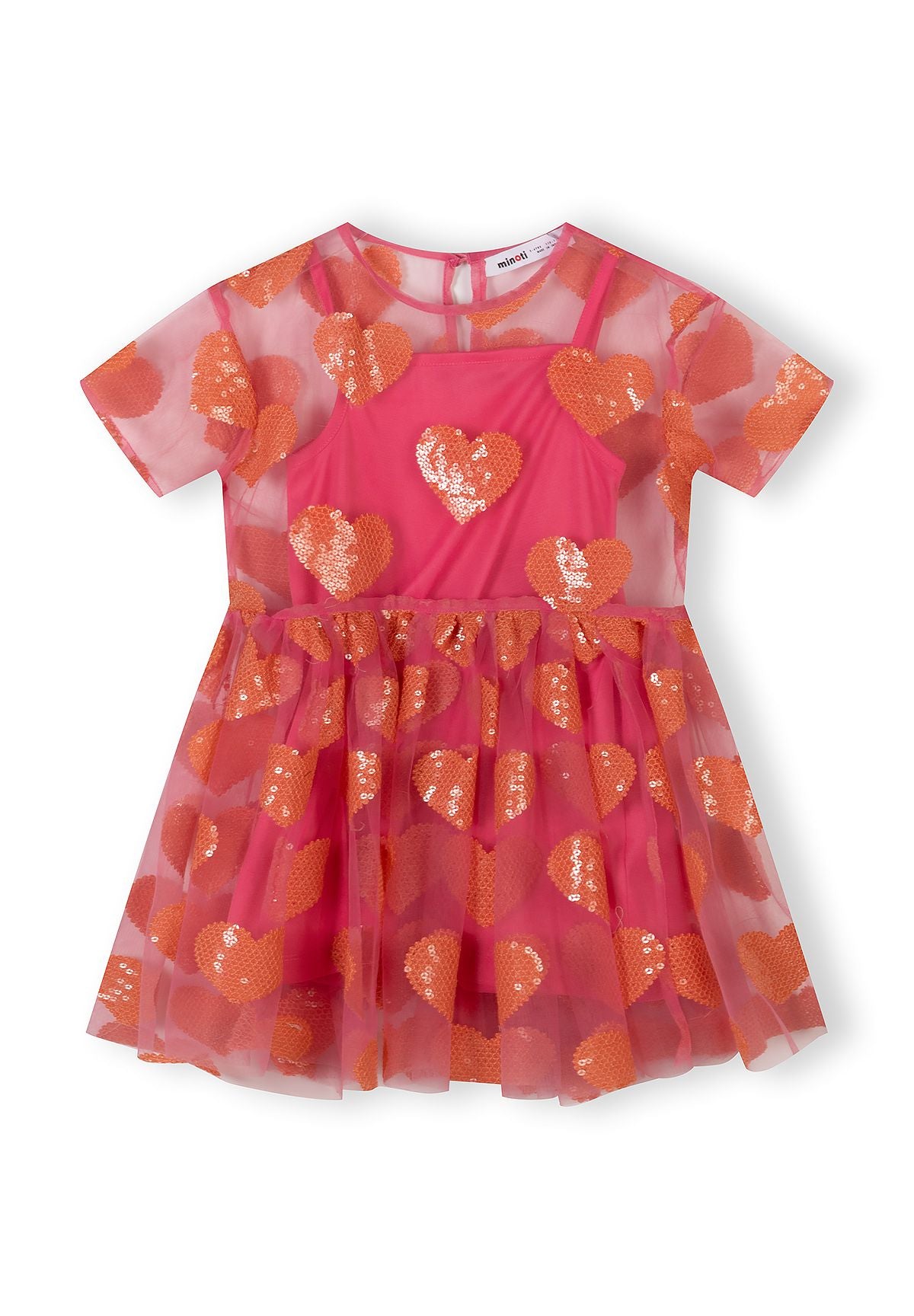 Flat lay of pink tulle dress with orange sequin hearts, showing short sleeves and gathered skirt design on white background
