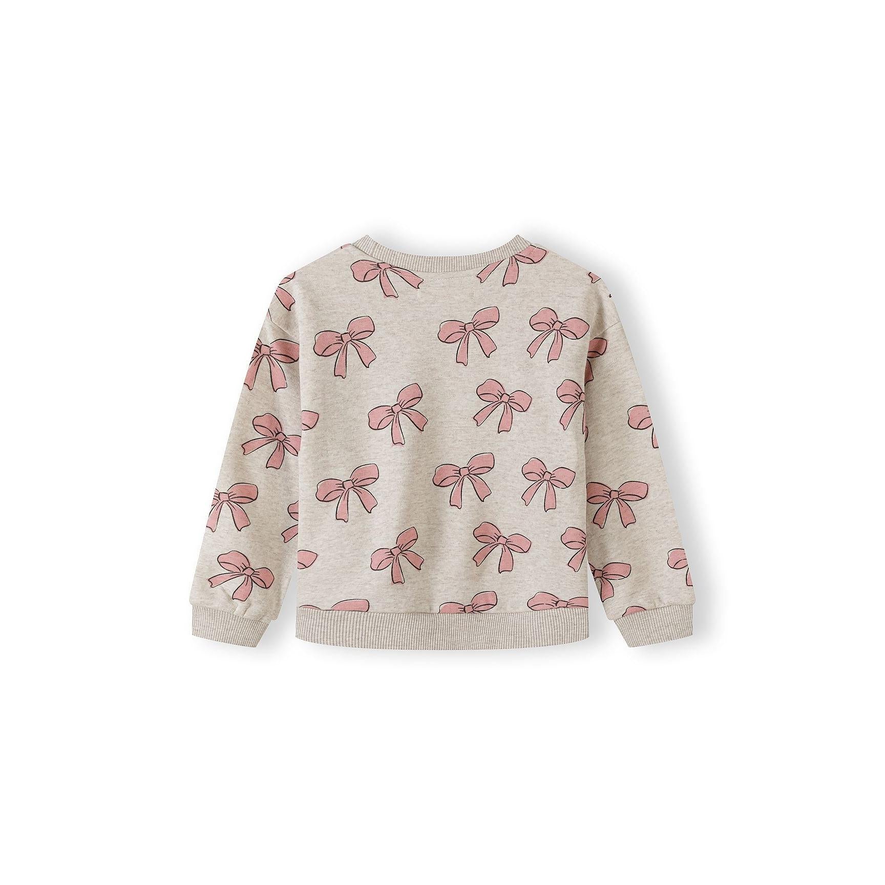 Close-up detail of pink sweatshirt showing cute bunny character graphic with striped ears, bow tie and black and white striped outfit