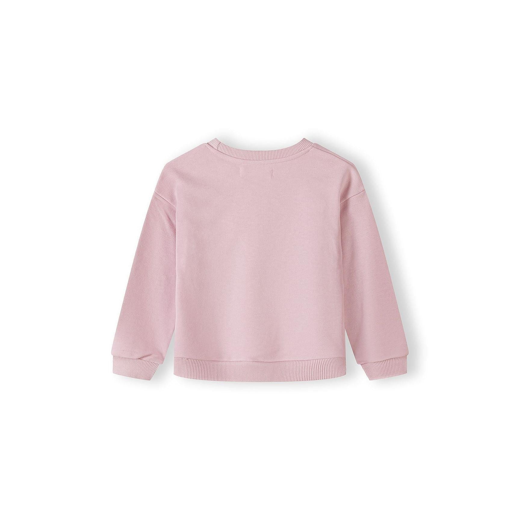 Close-up detail of pink sweatshirt showing cute bunny character graphic with striped ears, bow tie and black and white striped outfit