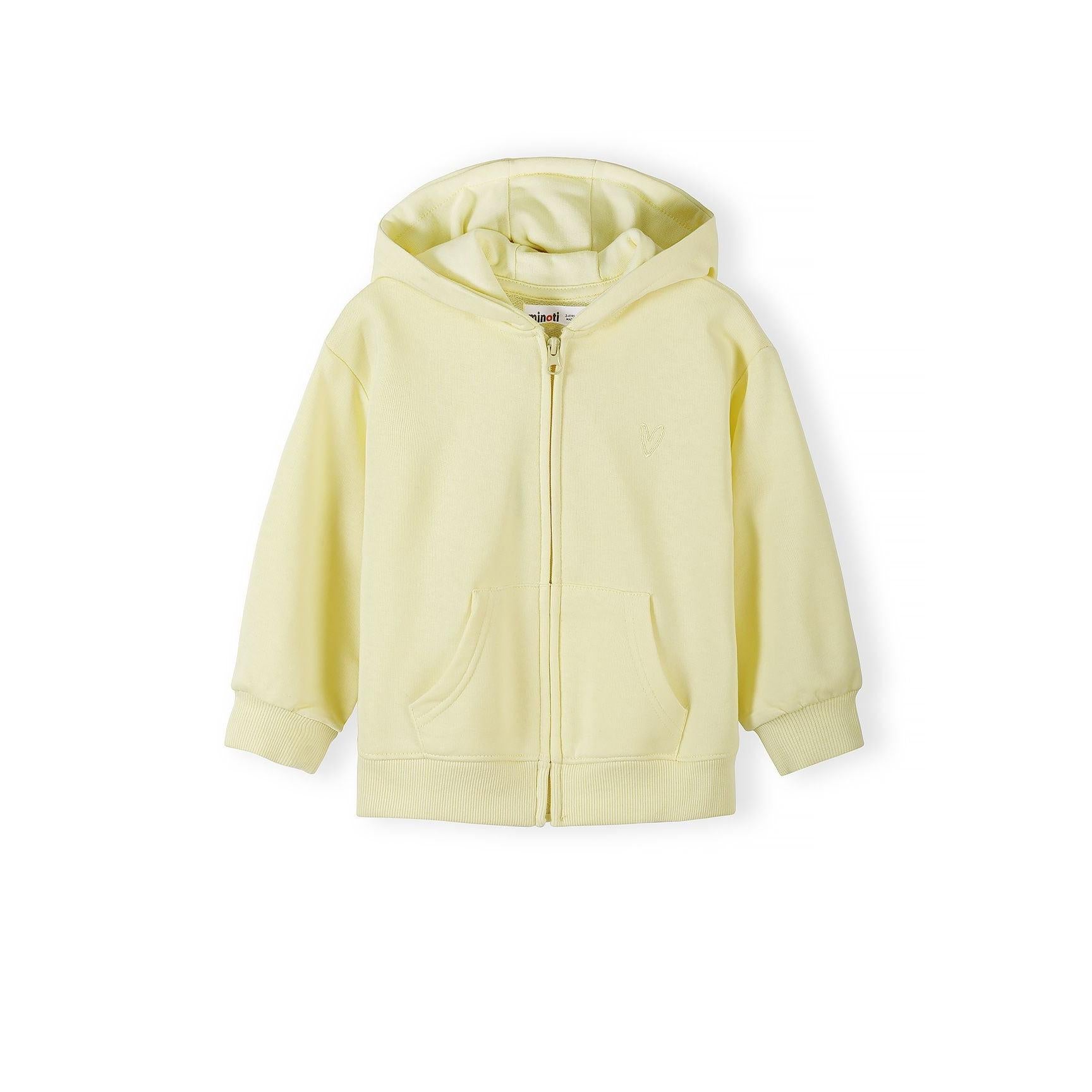 Close-up view of pale yellow zip hoodie showing soft fabric texture, hood detail and front zip closure against white background