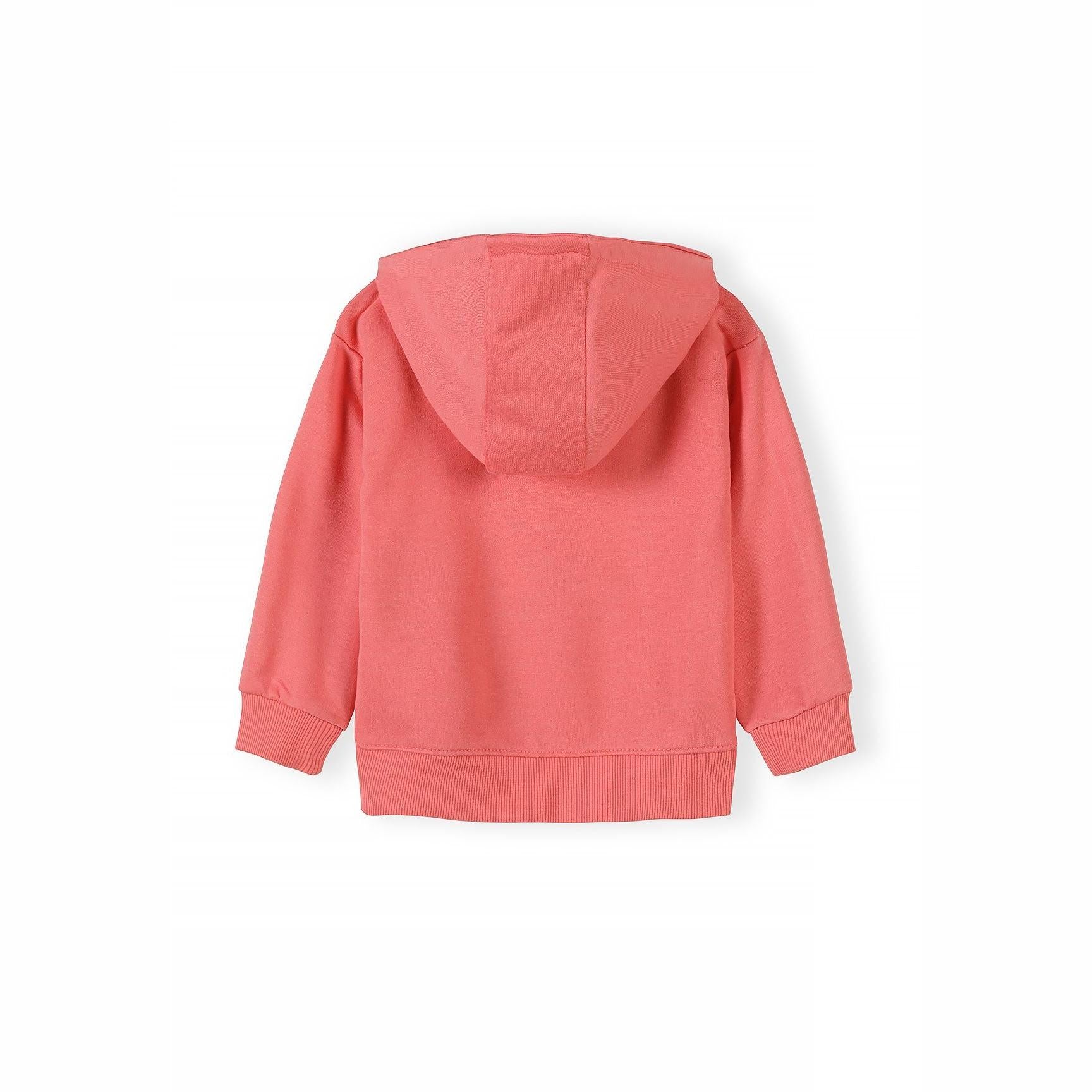 Detail view showing embroidered white heart design on coral pink hoodie fabric with zip visible on left side