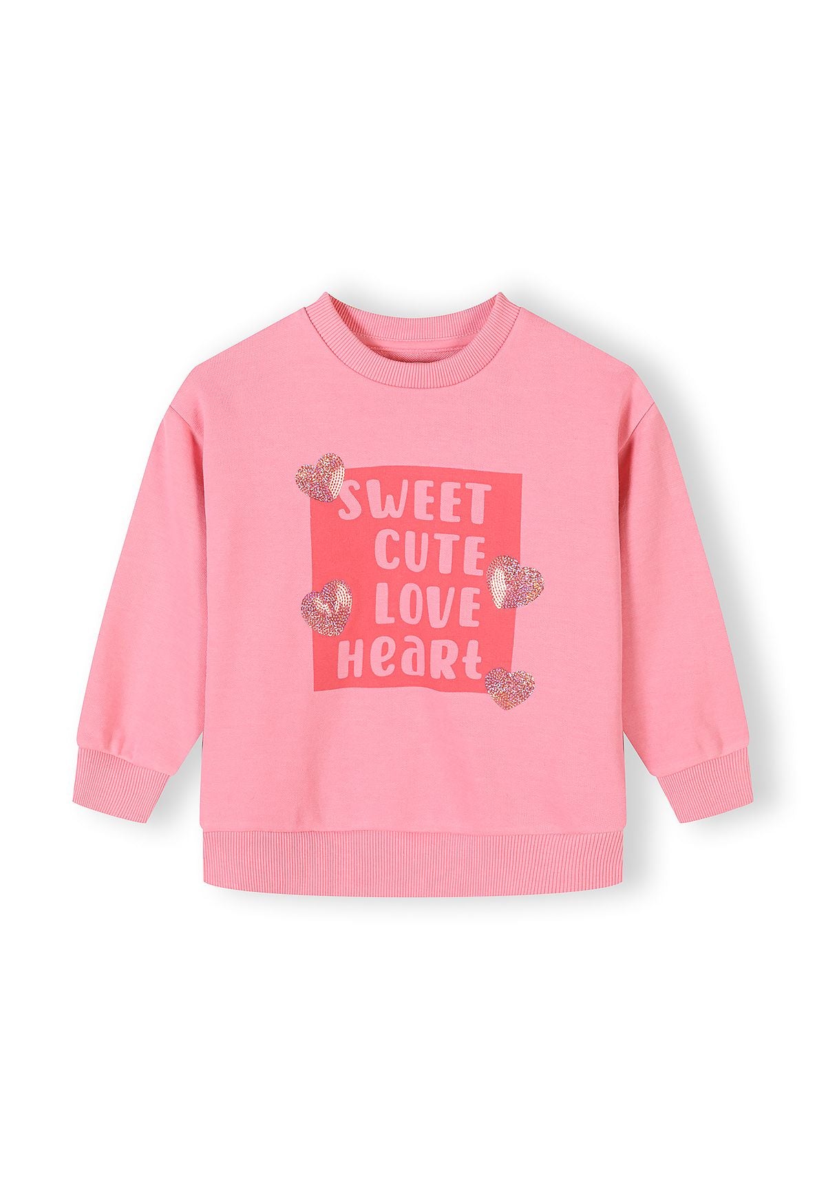 Girls pink sweatshirt with long sleeves and heart print, front view.