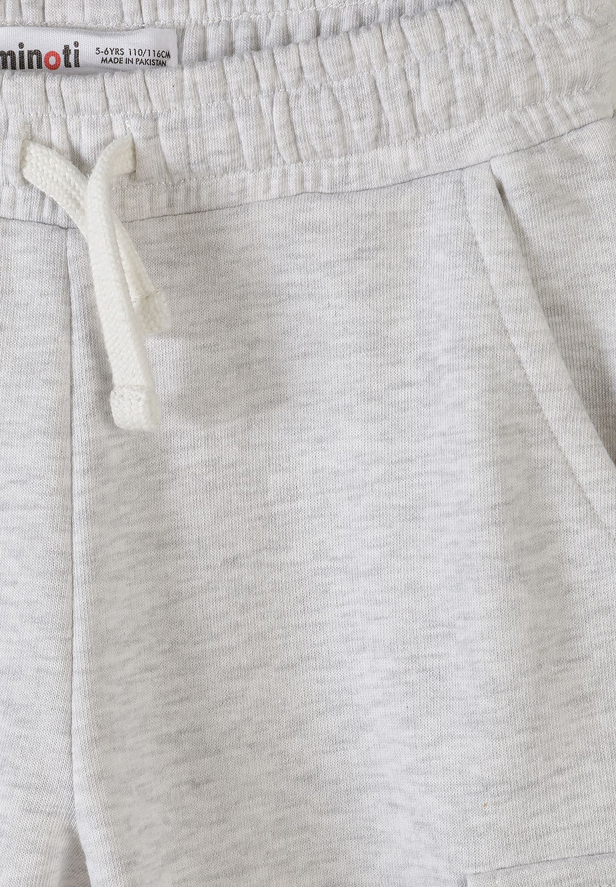 Close-up of grey marl joggers' gathered waist, cream drawcord and slanted side pocket.
