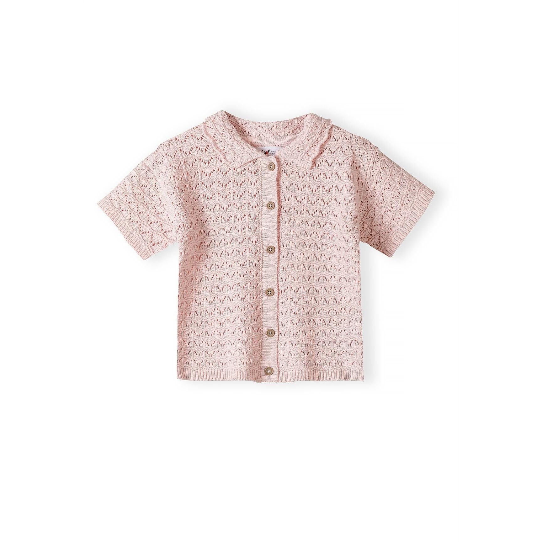 Close-up detail of blush pink pointelle knit showing button placket with light colored buttons and Minoti brand label