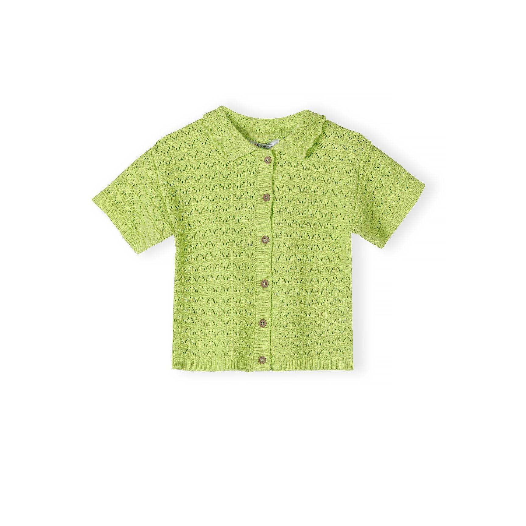 Close-up detail of lime green pointelle knit fabric showing decorative eyelet pattern, button placket with matching buttons, and Minoti brand label