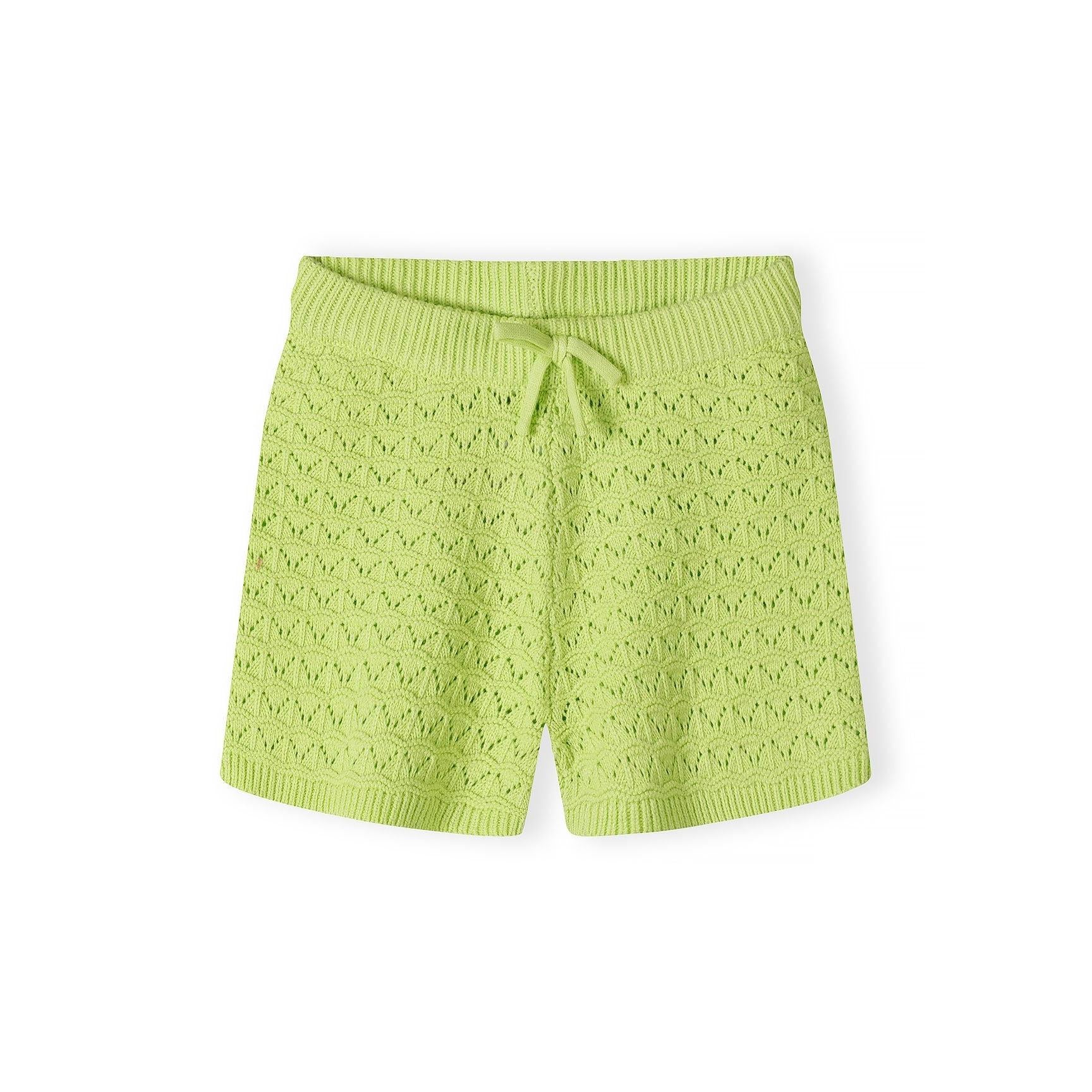 Close-up detail of lime green pointelle knit fabric showing decorative eyelet pattern, button placket with matching buttons, and Minoti brand label
