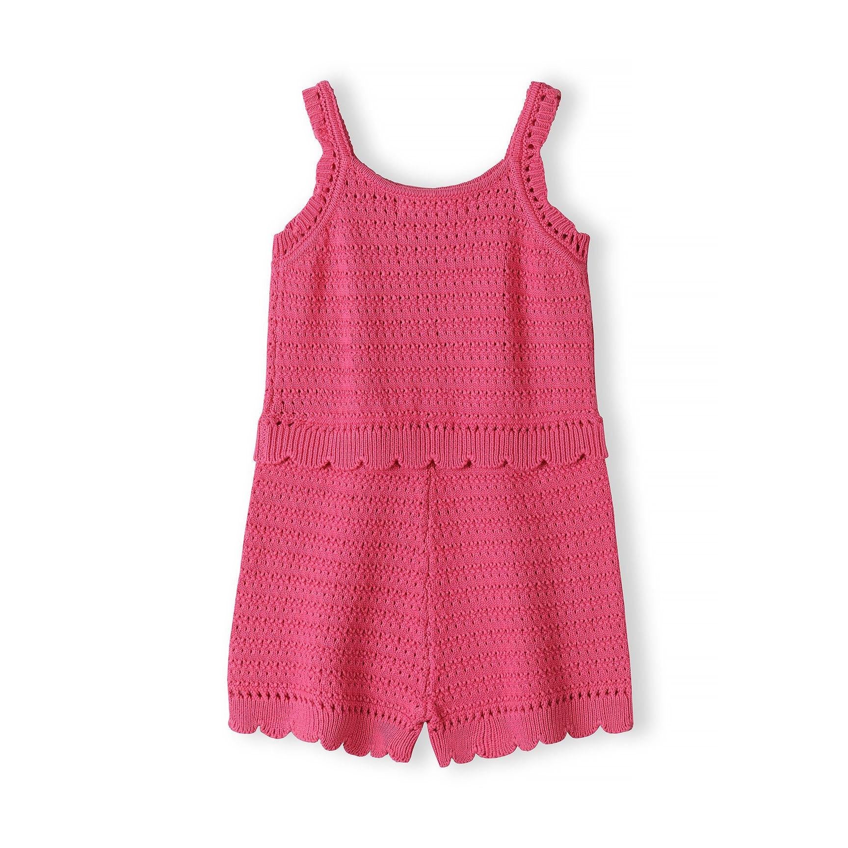 Front view of pink crochet jumpsuit showing detailed lacework construction and decorative scalloped edges on white background
