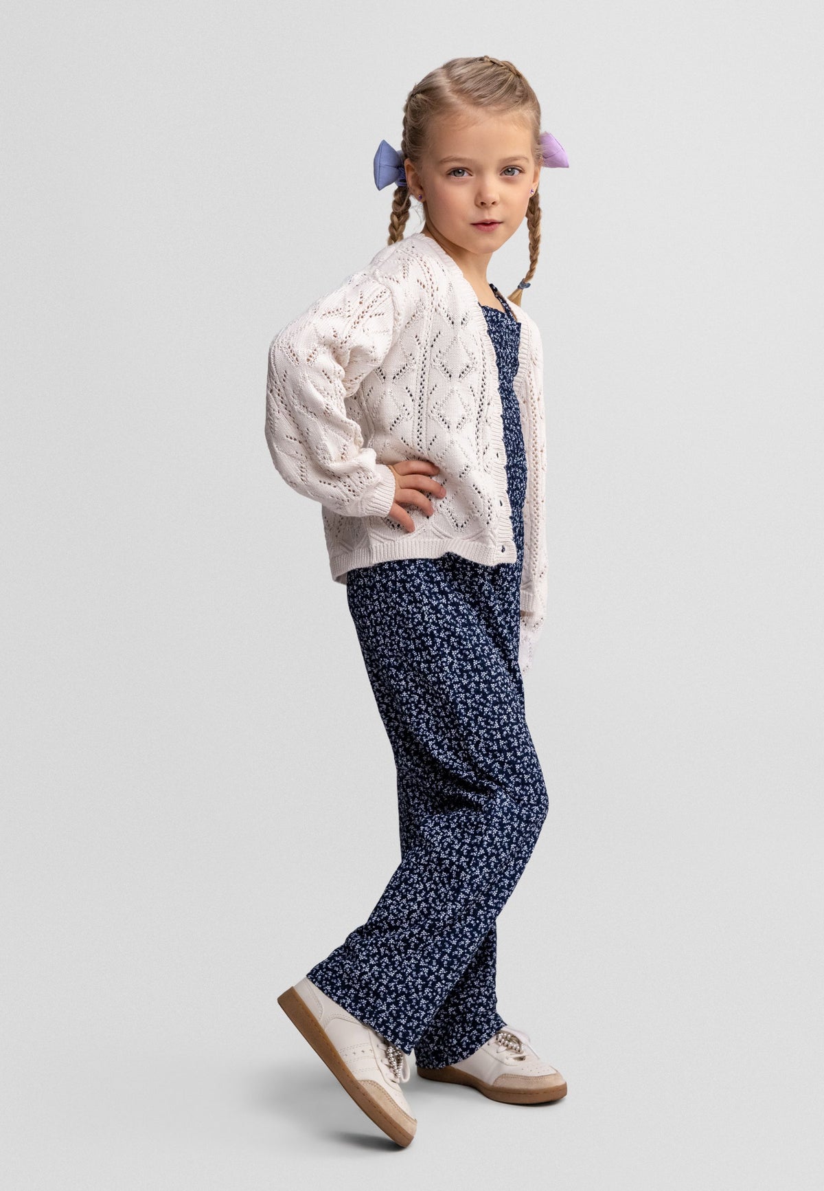 Off-white pointelle cardigan, model front.
