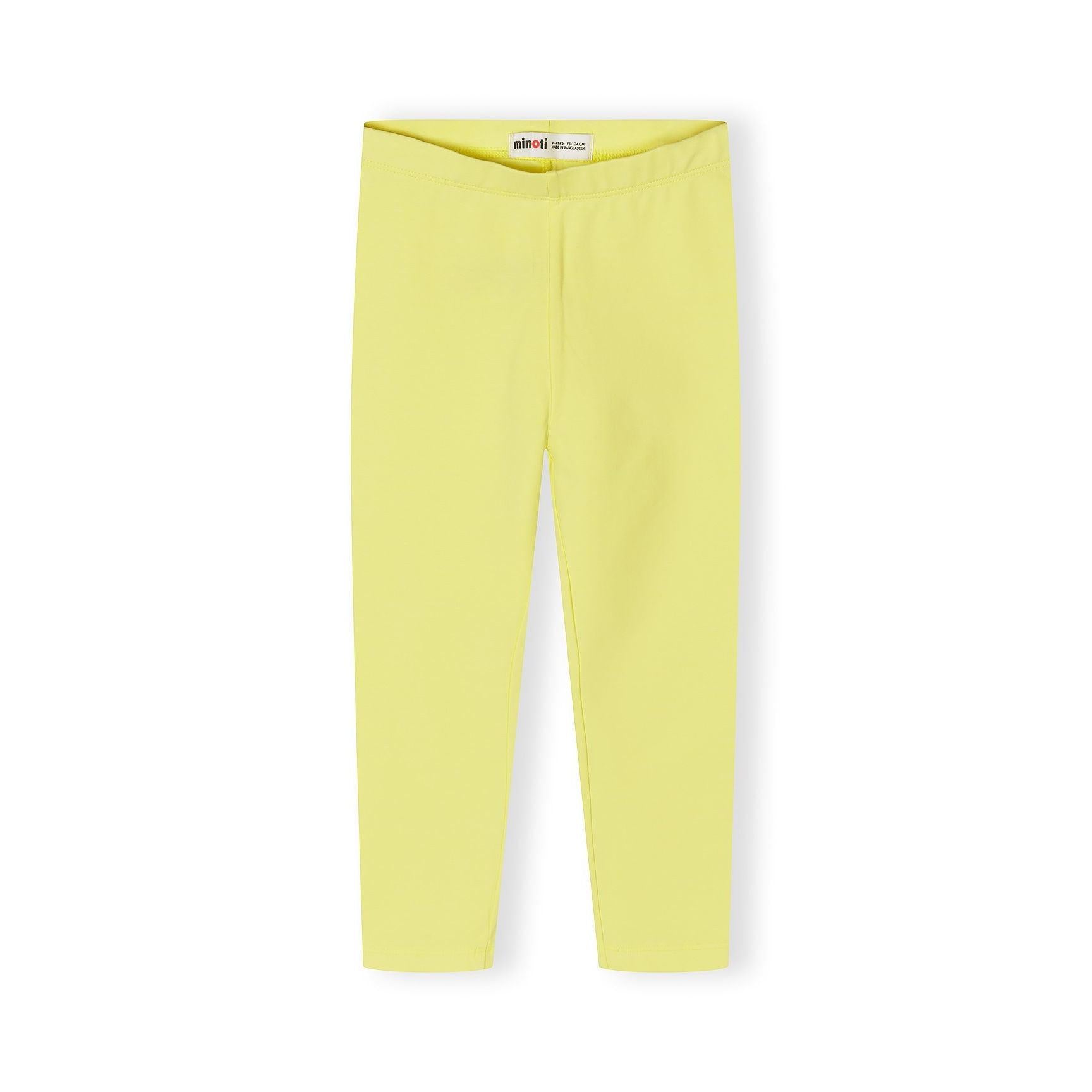 Close up detail of coral pink leggings showing soft fabric texture and comfortable elastic waistband construction