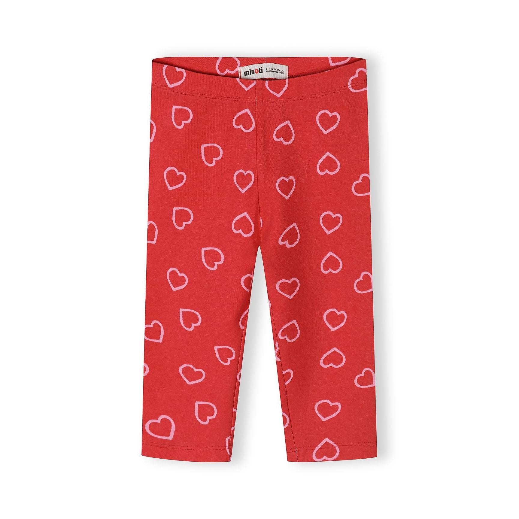 Close-up detail of coral pink and red striped capri leggings showing fabric texture and Minoti brand label at waistband