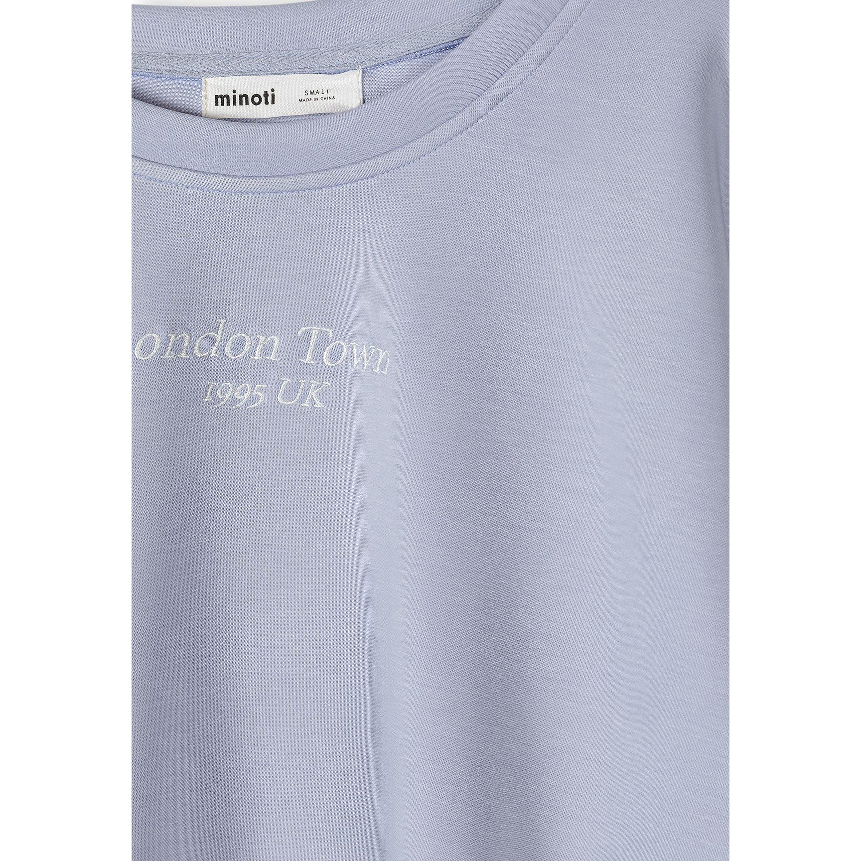 Close-up detail of Minoti label and London Town 1995 UK embroidered text on lavender fabric