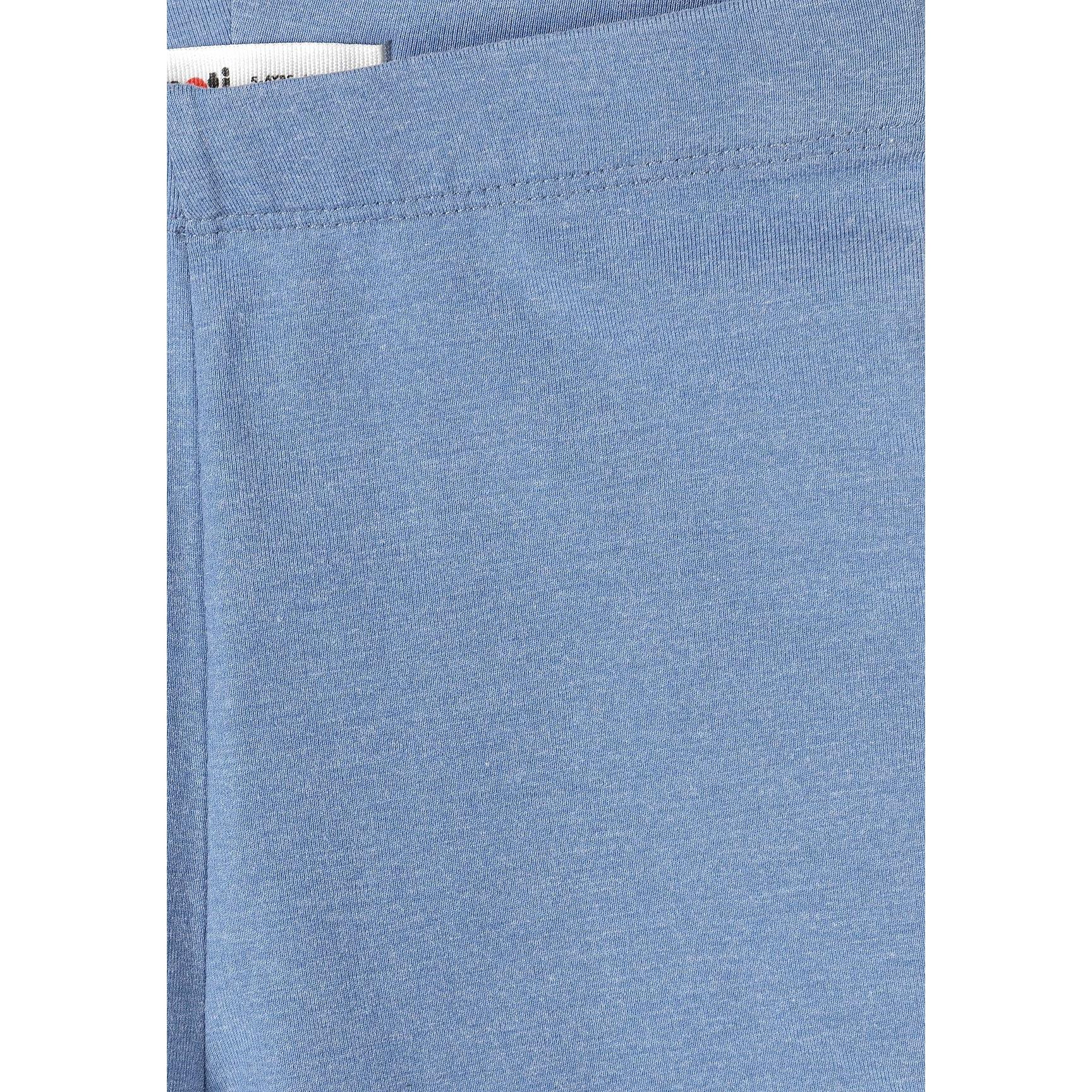 Close-up detail of blue cycling shorts showing fabric texture, stitching quality and Minoti label with brand name clearly visible