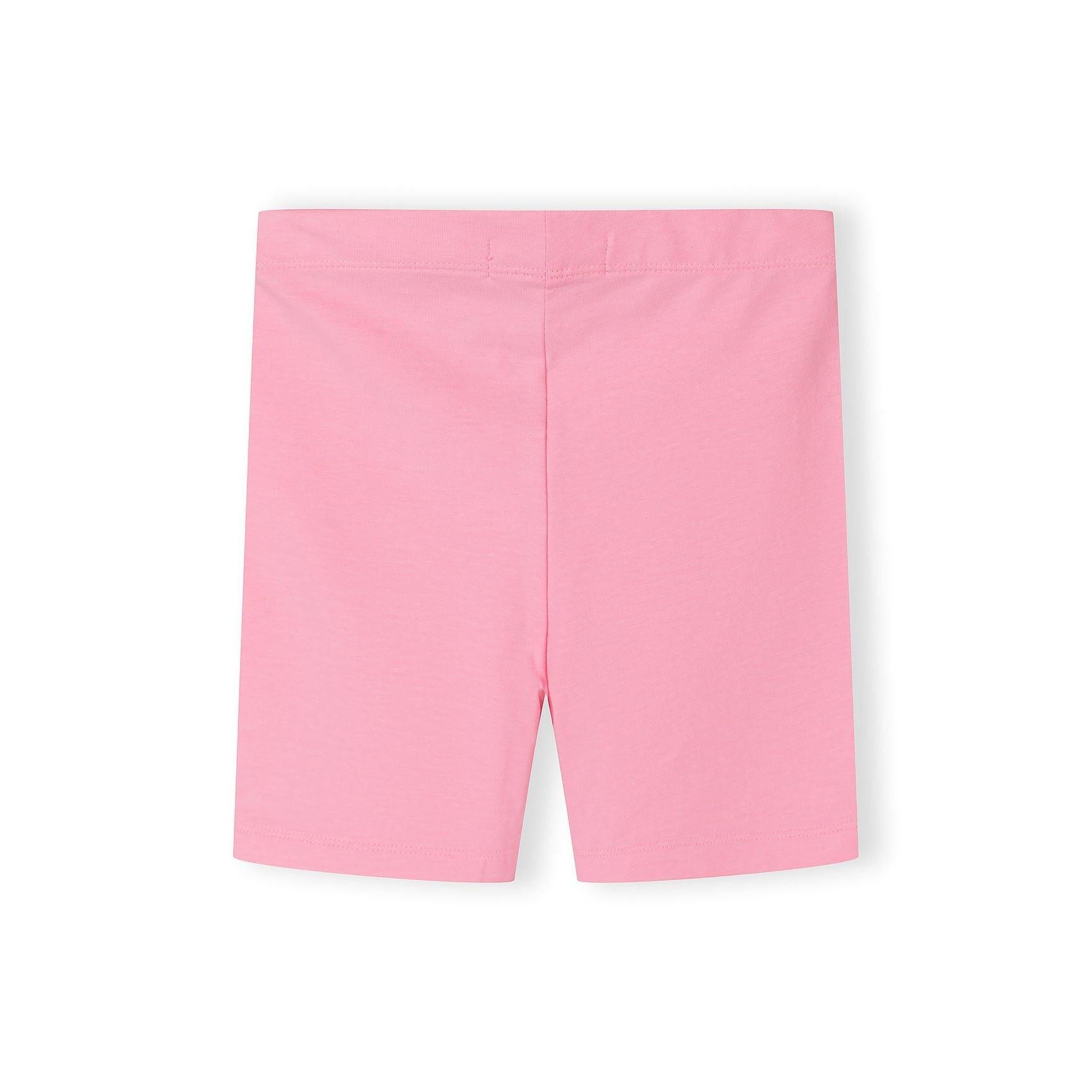 Single pair of bright pink cycling shorts laid flat against white background showing smooth fabric texture and fitted silhouette
